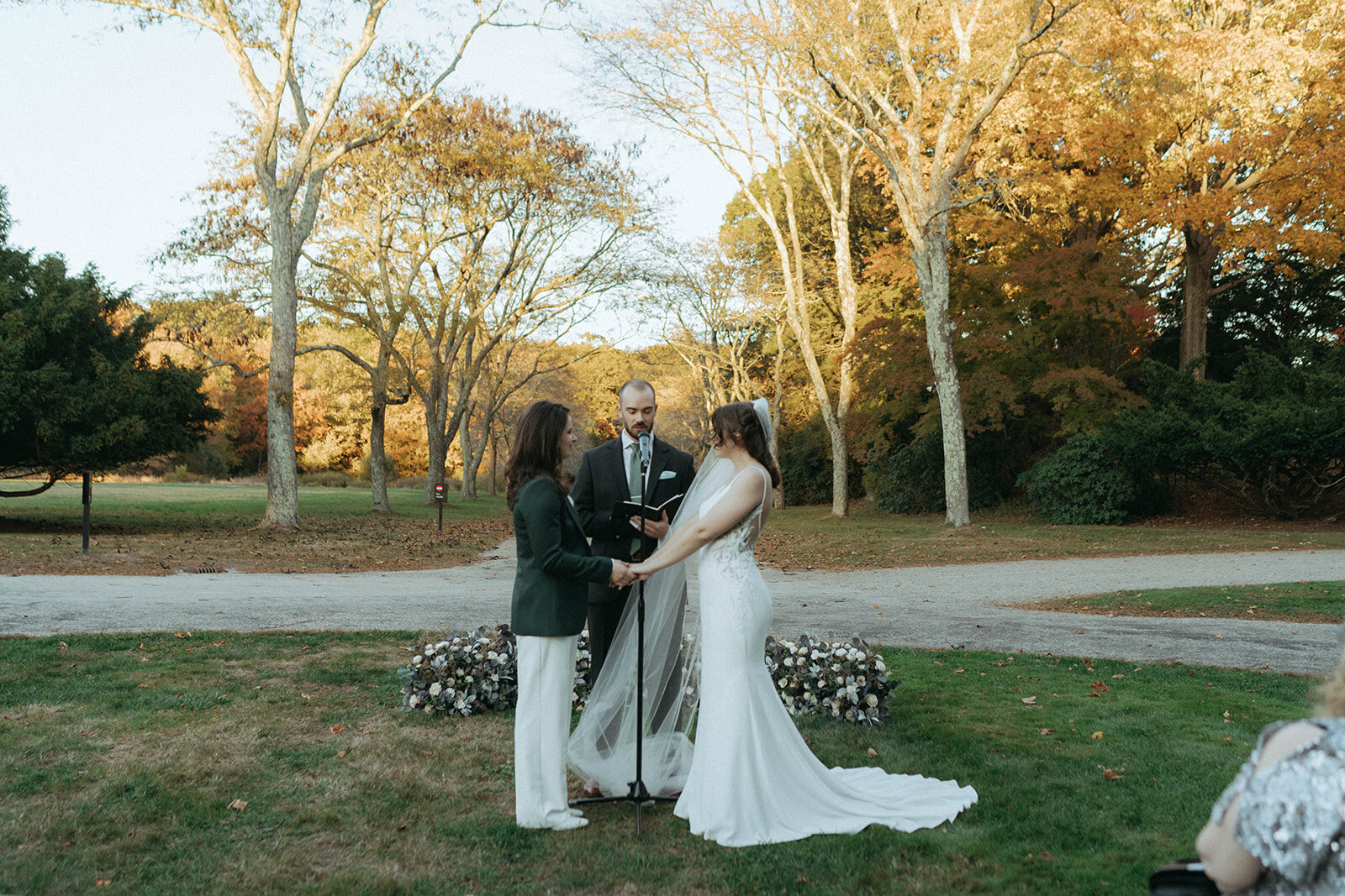 2 brides standing at the altar during their wedding, shot by elsie goodman photography