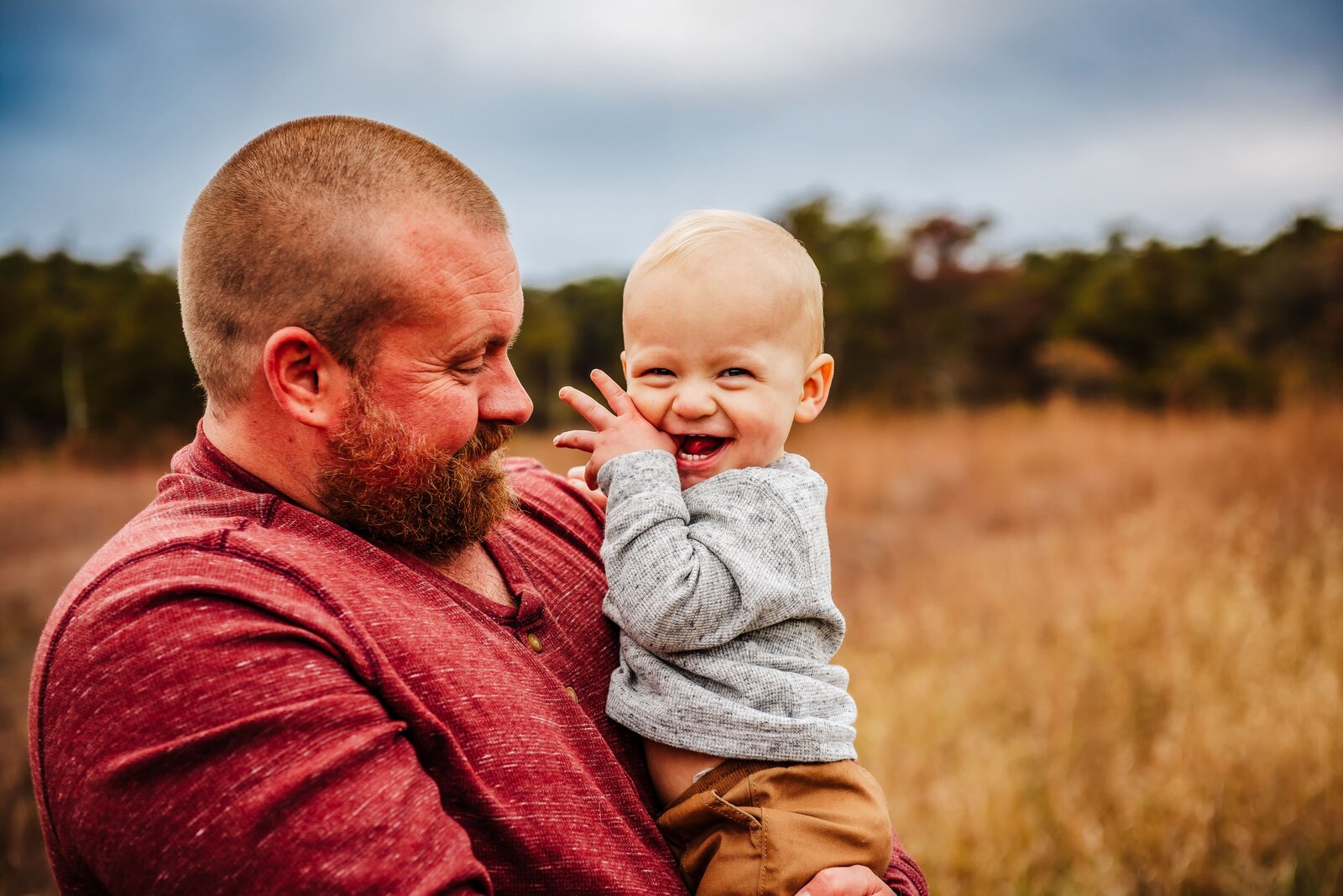 dad holding a toddler boy