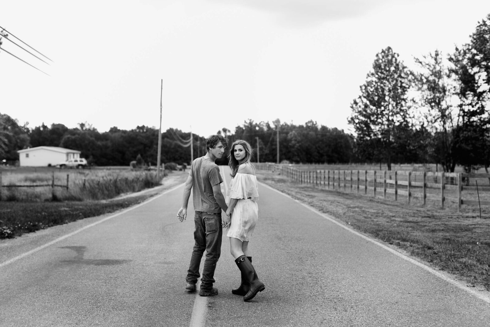 engaged couple country road