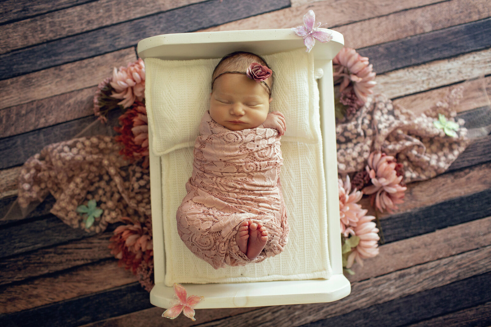 baby-girl-with-pink-flowers