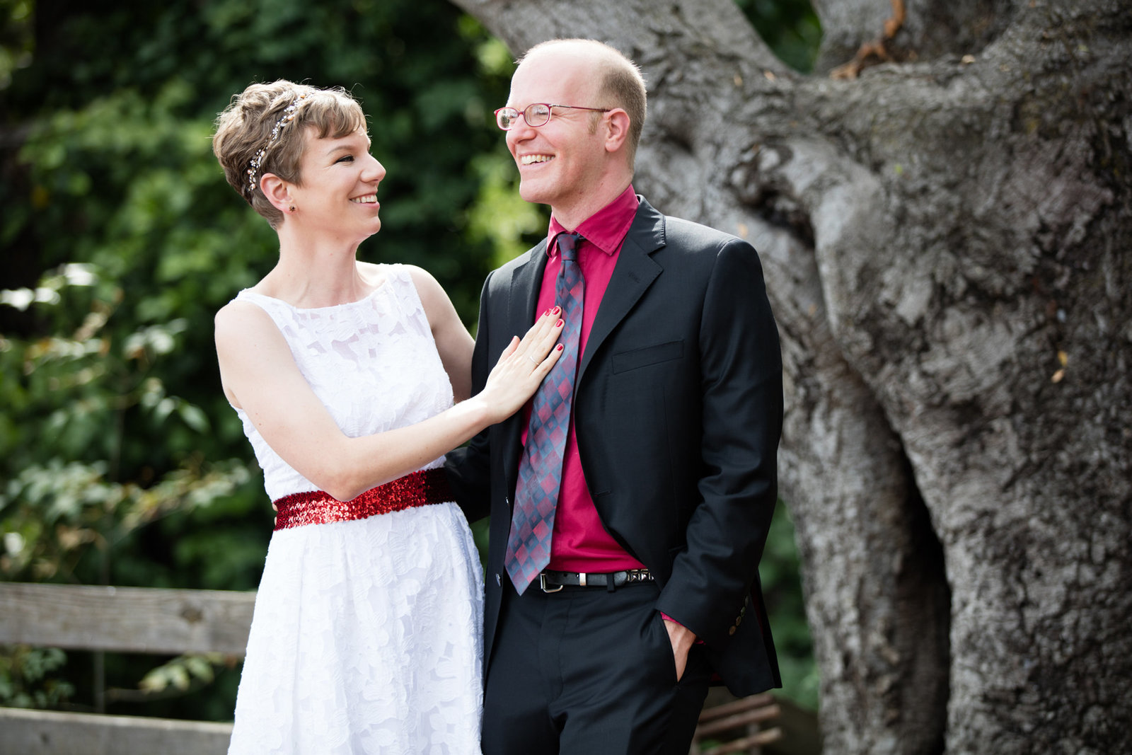 Bride and groom smile and laugh in portrait at stunning northern california wedding