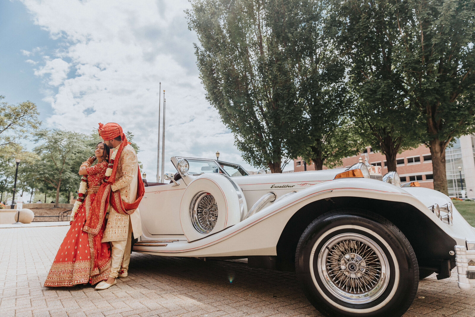 Hindu bride and groom with car