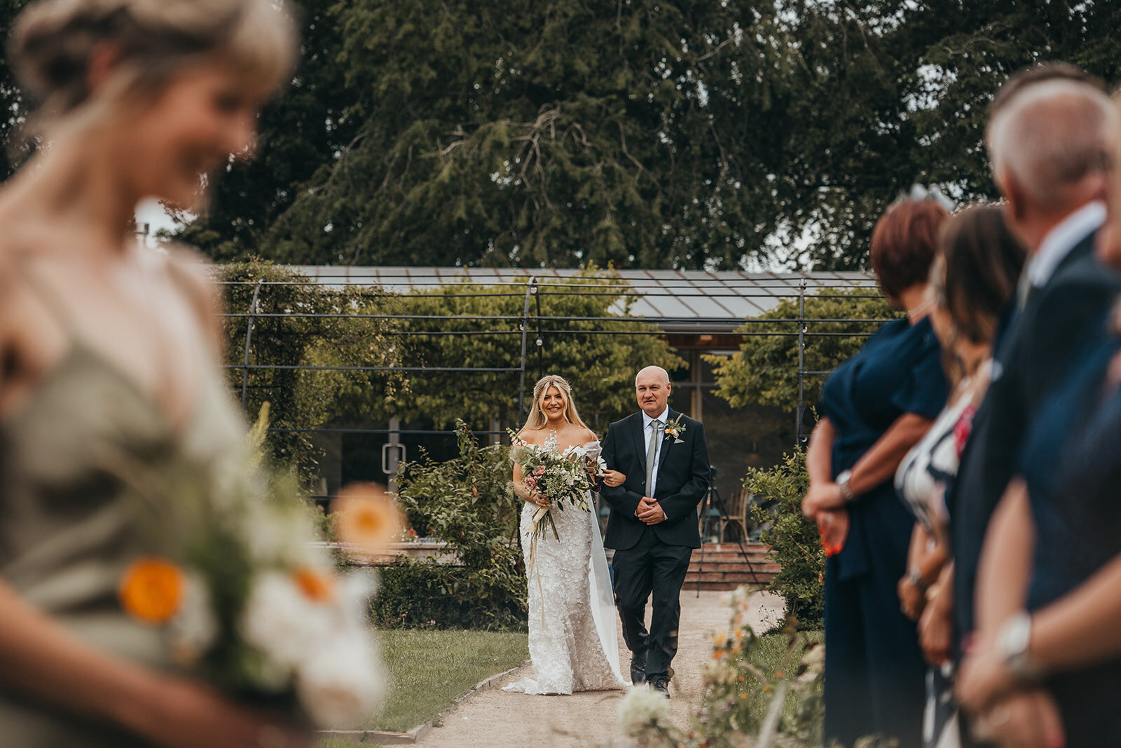 bride arrives at ceremony with father
