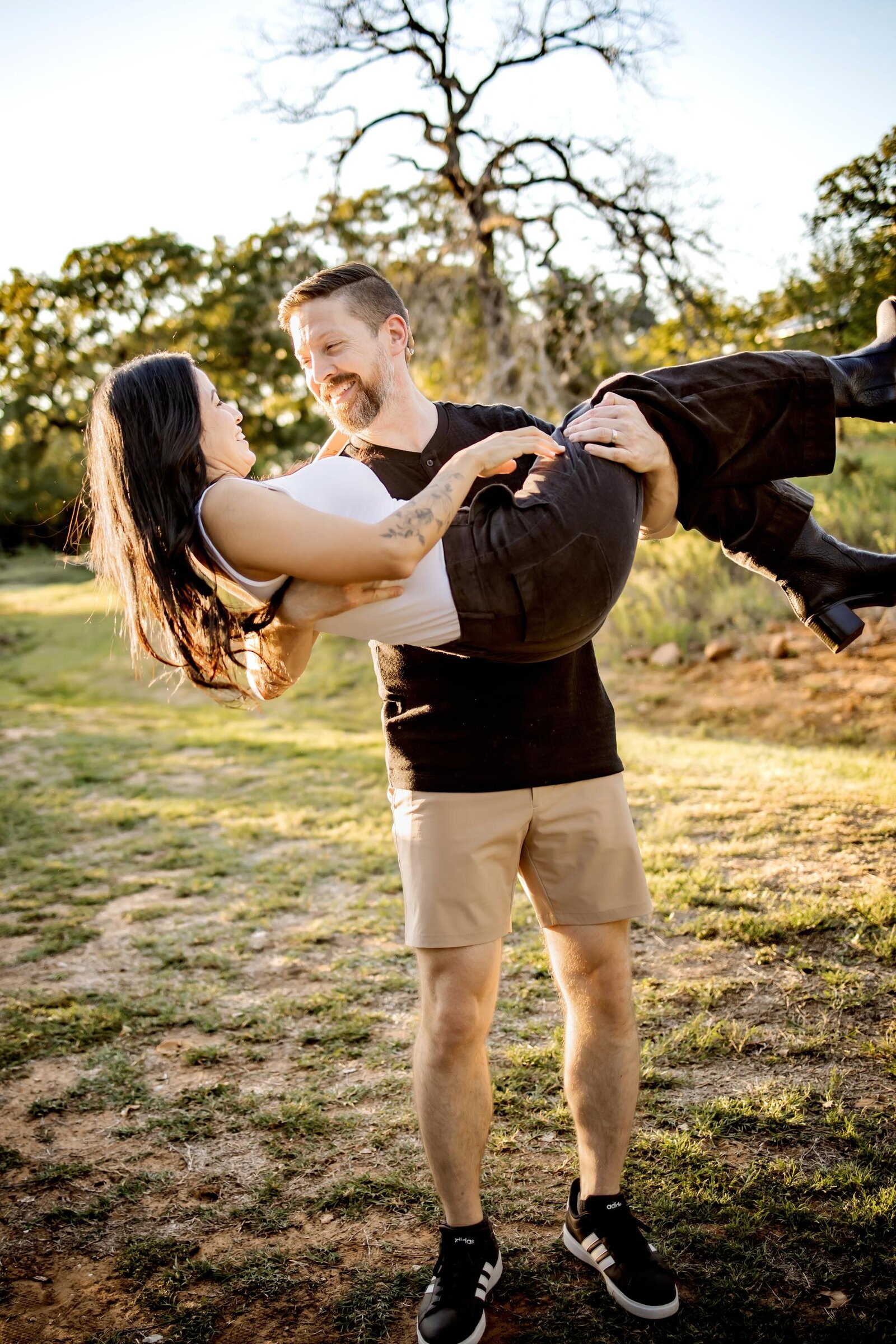 Husband and wife being playful at a session in Southlake Texas