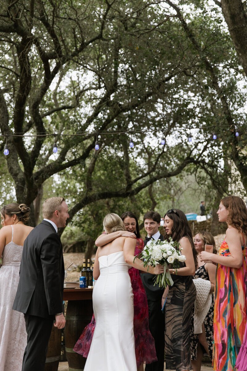 People hugging at wedding by washington adventure elopement photographer
