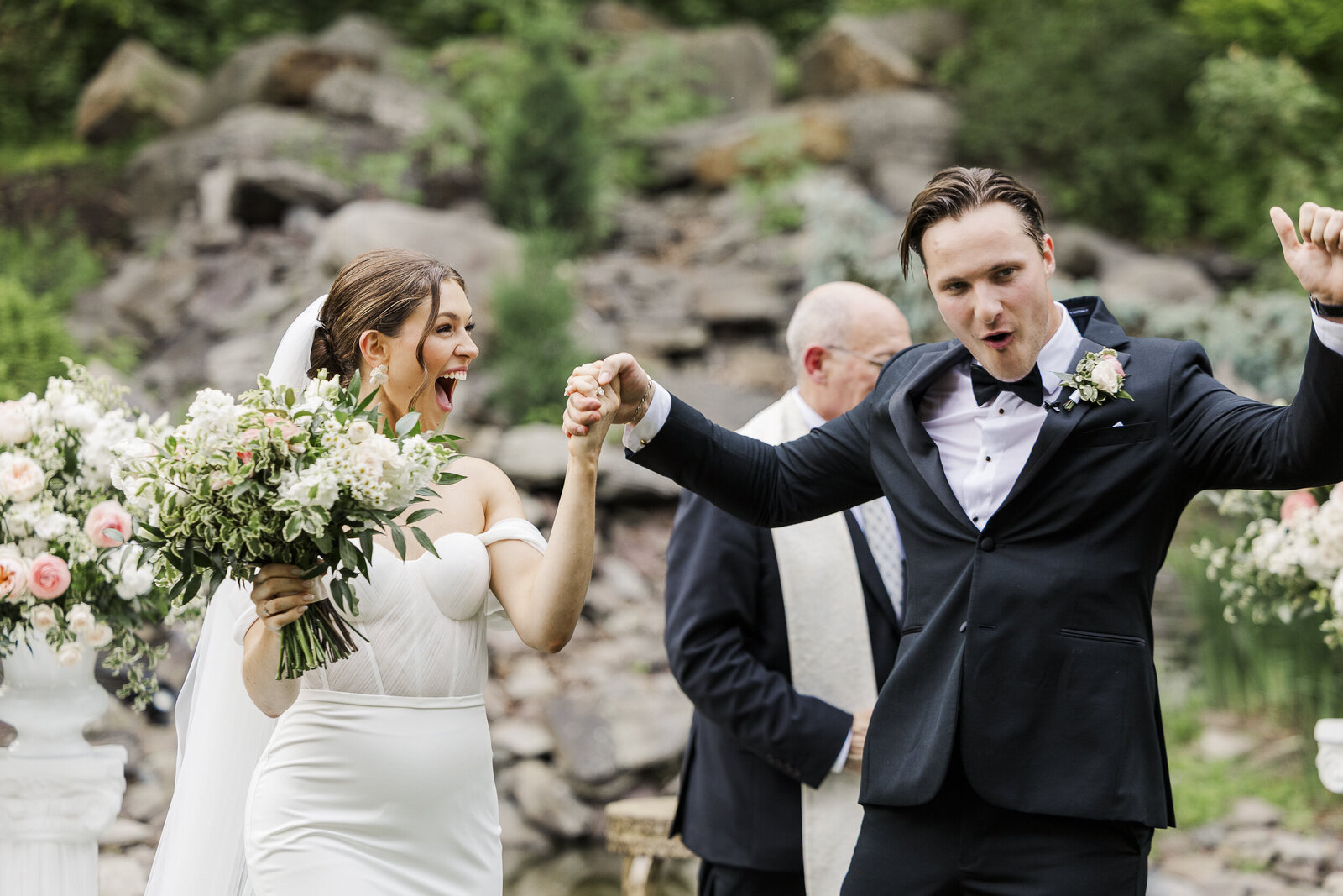 Ali and Alek celebrating with their wedding party in Saugerties, candid Hudson Valley wedding photography