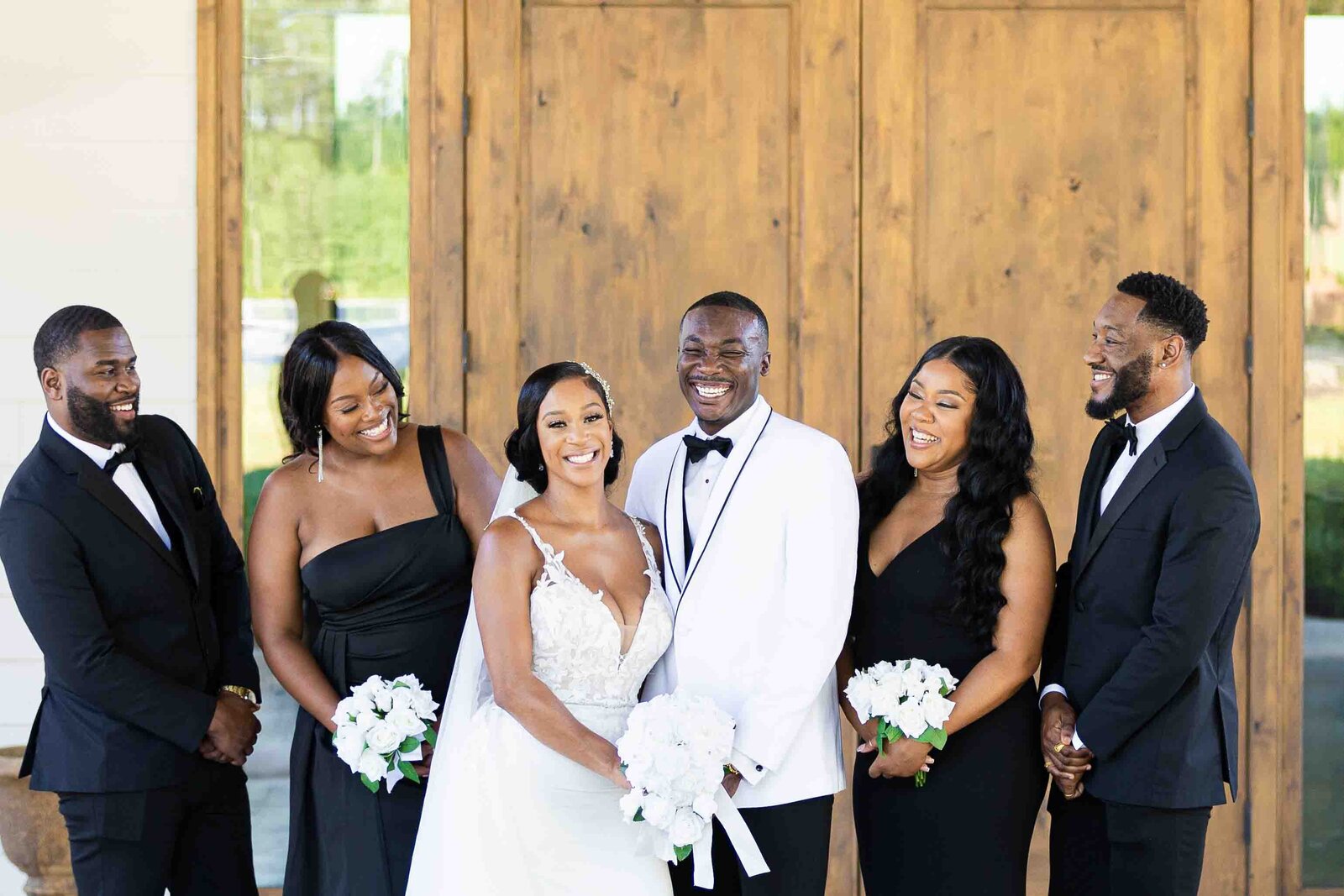 Black married couple with bridal party at Dugaren Vineyards