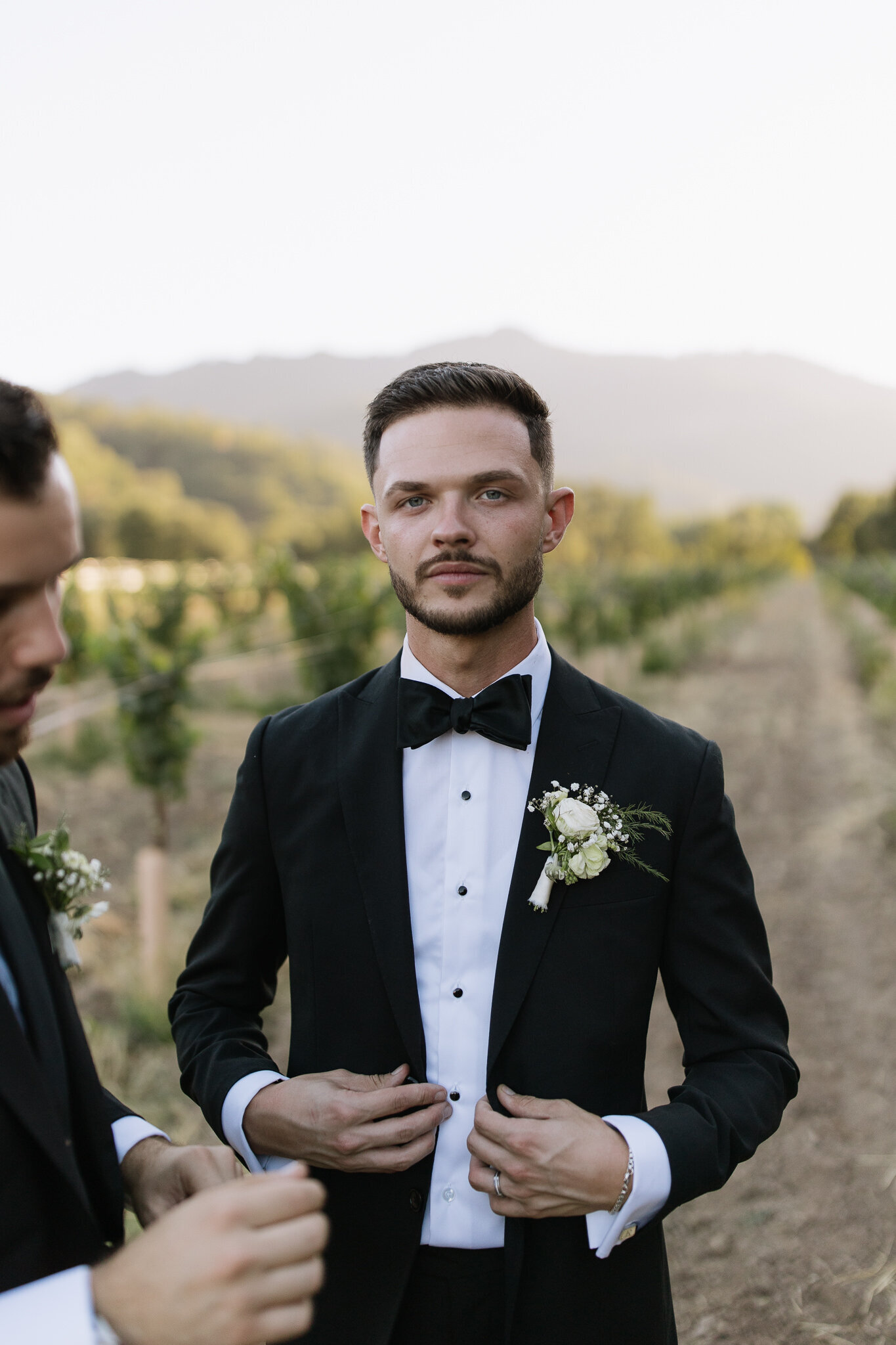 Individual groom portraits with vineyard backdrop at Nelson Family Vineyards
