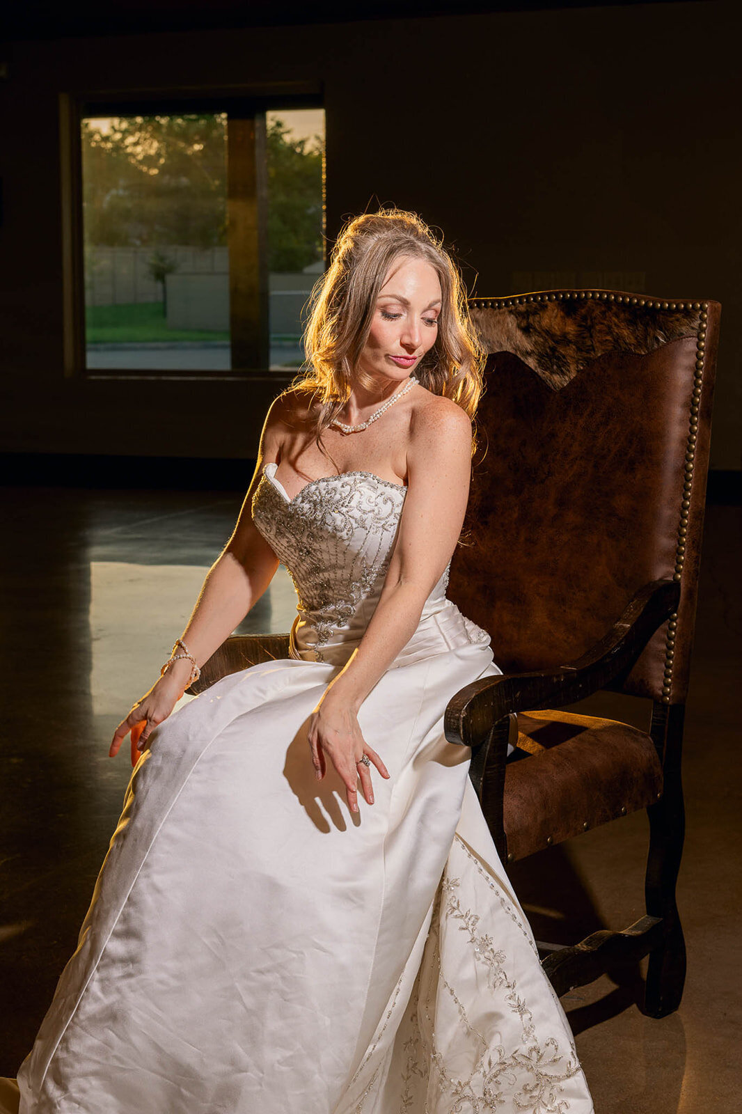 A bride poses elegantly indoors, captured during a luxury wedding in San Antonio by CMH Studios