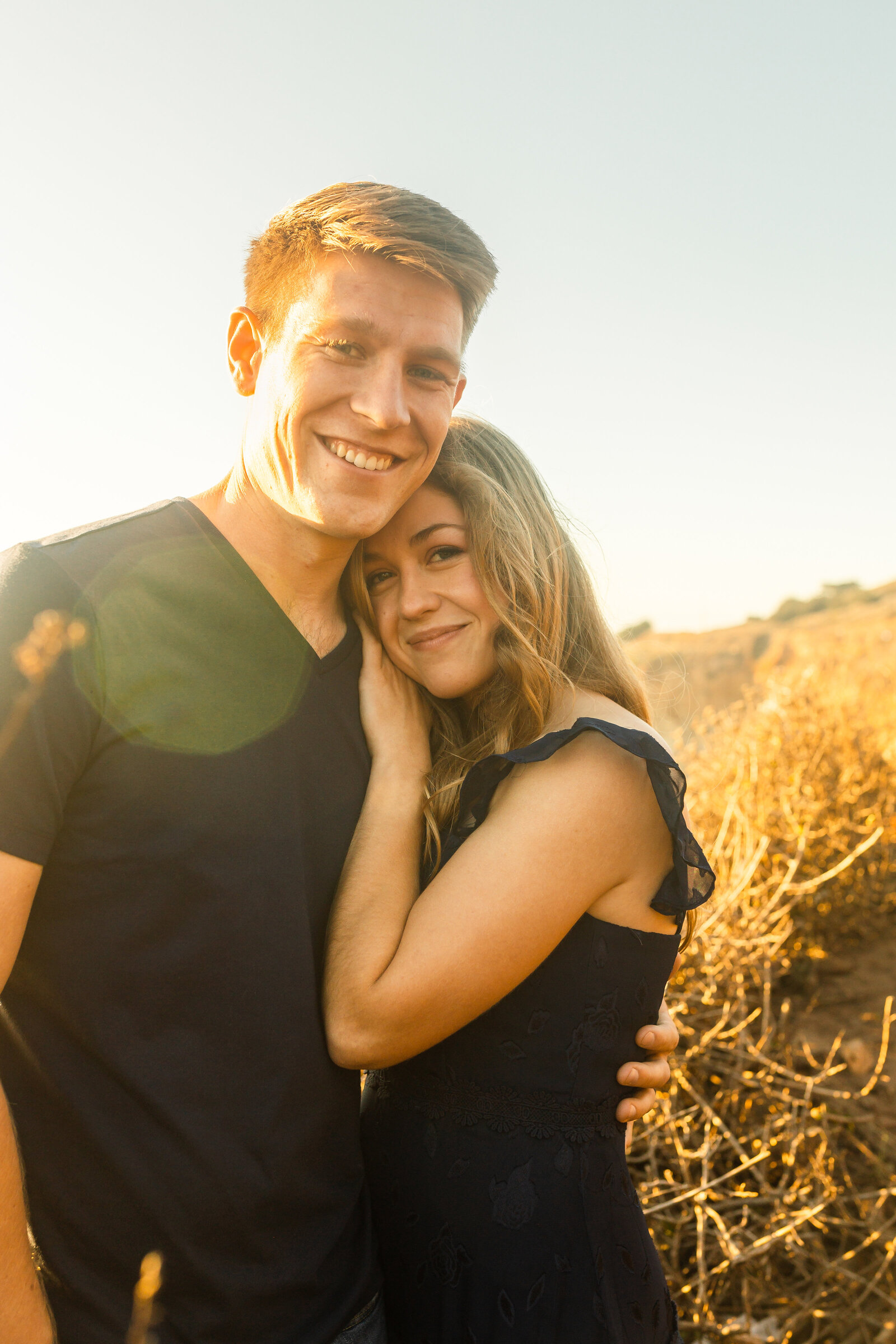 A couple poses for their engagement photos in Big Sur, California.