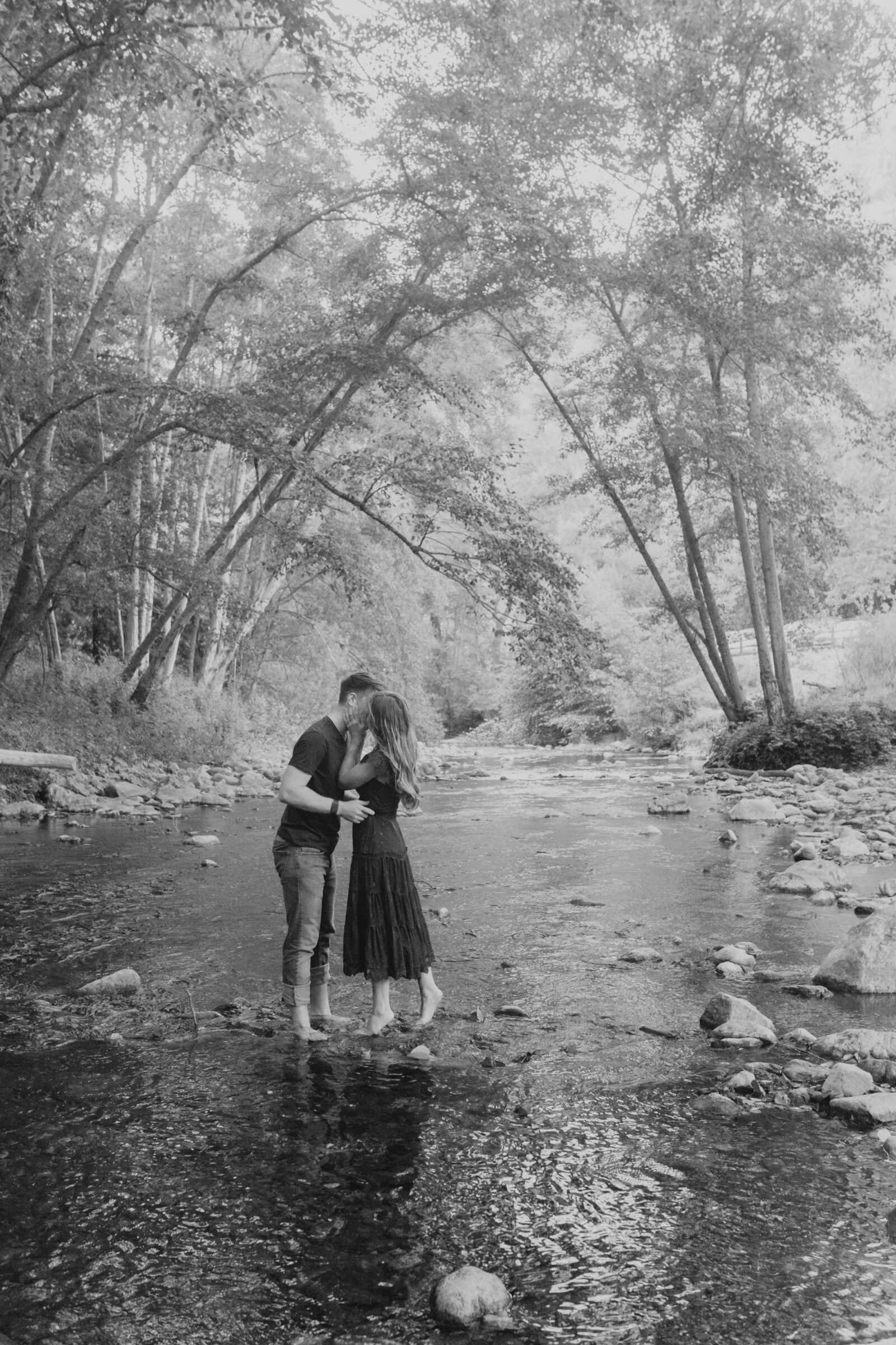 A couple poses for their engagement photos in Big Sur, California.