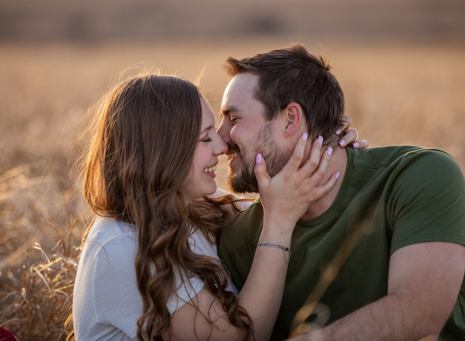 couple in golden light about to kiss