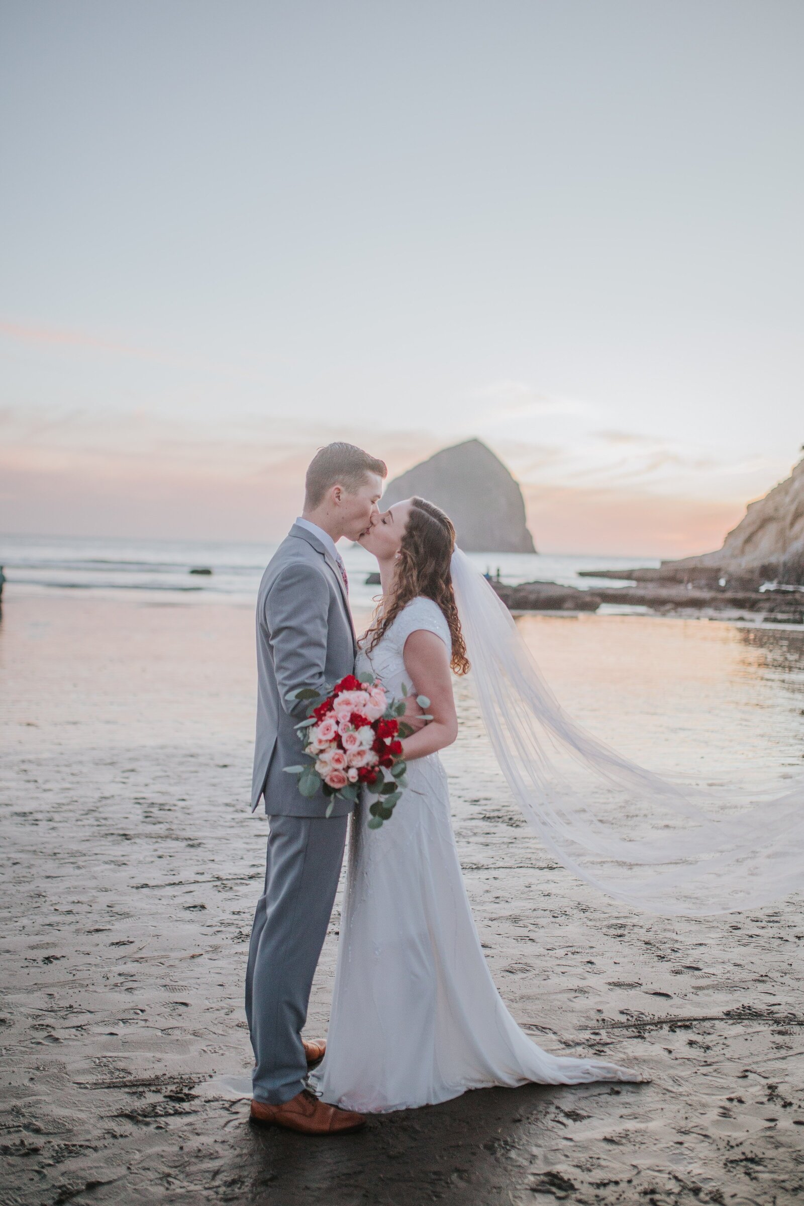 Sacramento Photographers capture bride and groom kissing on beach