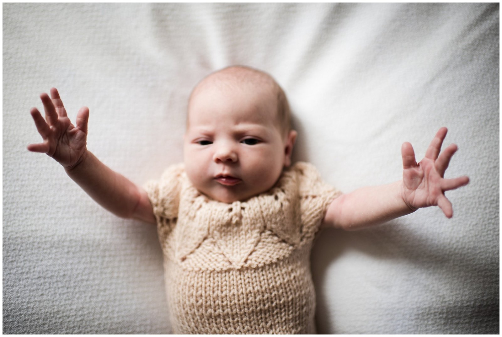 Newborn baby girl with arms outstretched Emily Ann Photography Seattle Photographer