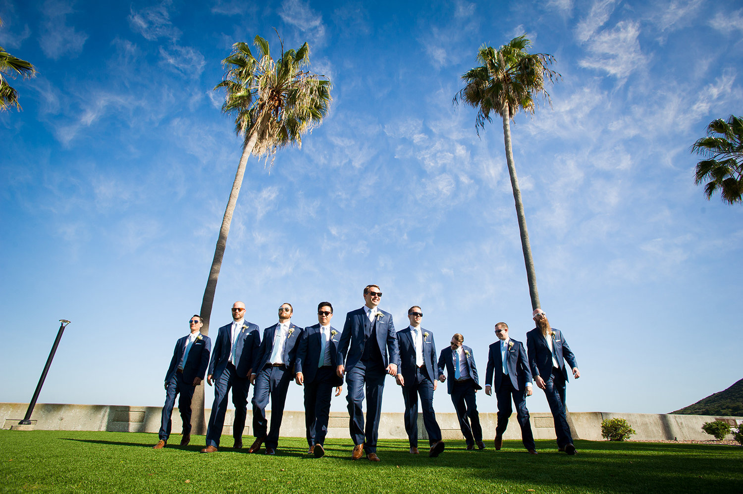 bridal party walking on grass at ocean view room