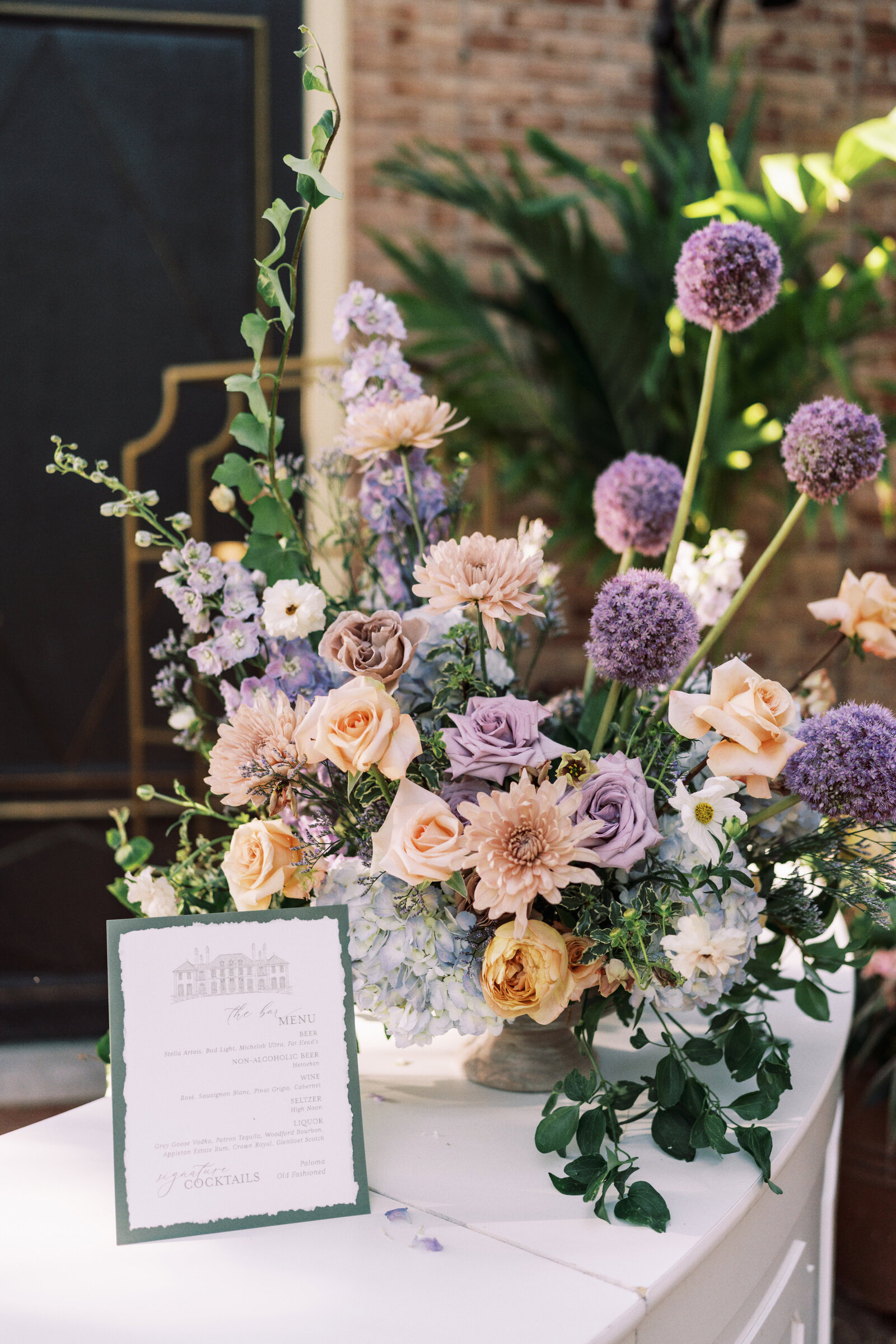 Wedding centerpiece with soft pink peach and lavender flowers