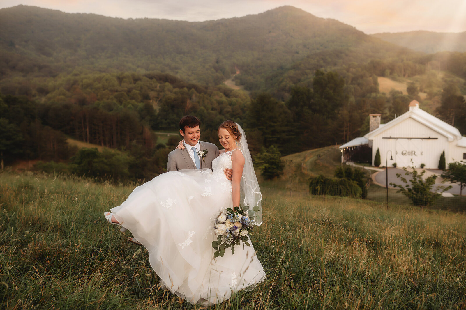 Newlyweds pose for Wedding Photos at Chestnut Ridge Events in Asheville, NC.