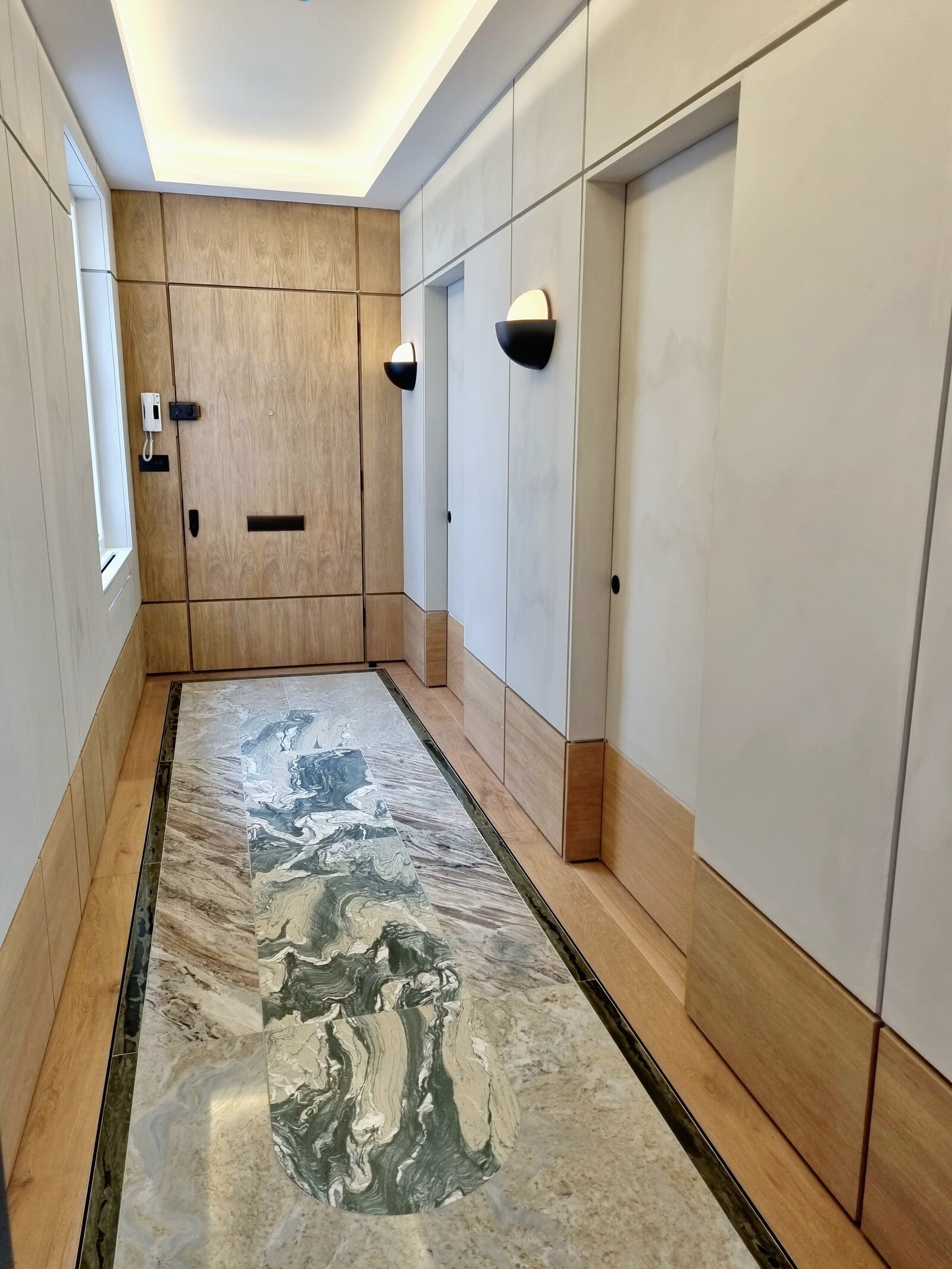 Marble floor wood clad hallway