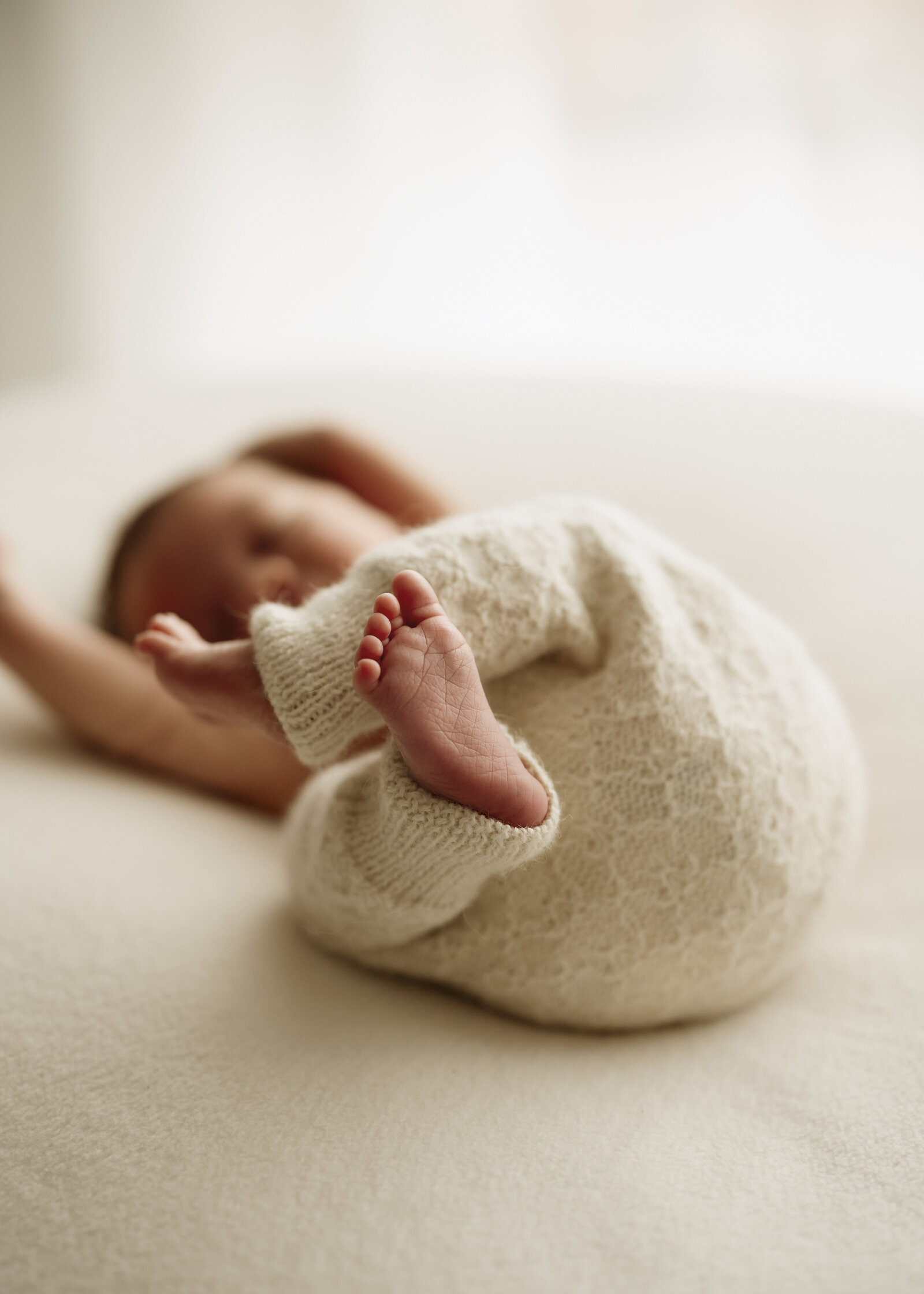 Natural newborn family portraits in a Perth studio – soft, warm, and organic images capturing the love of a growing family.