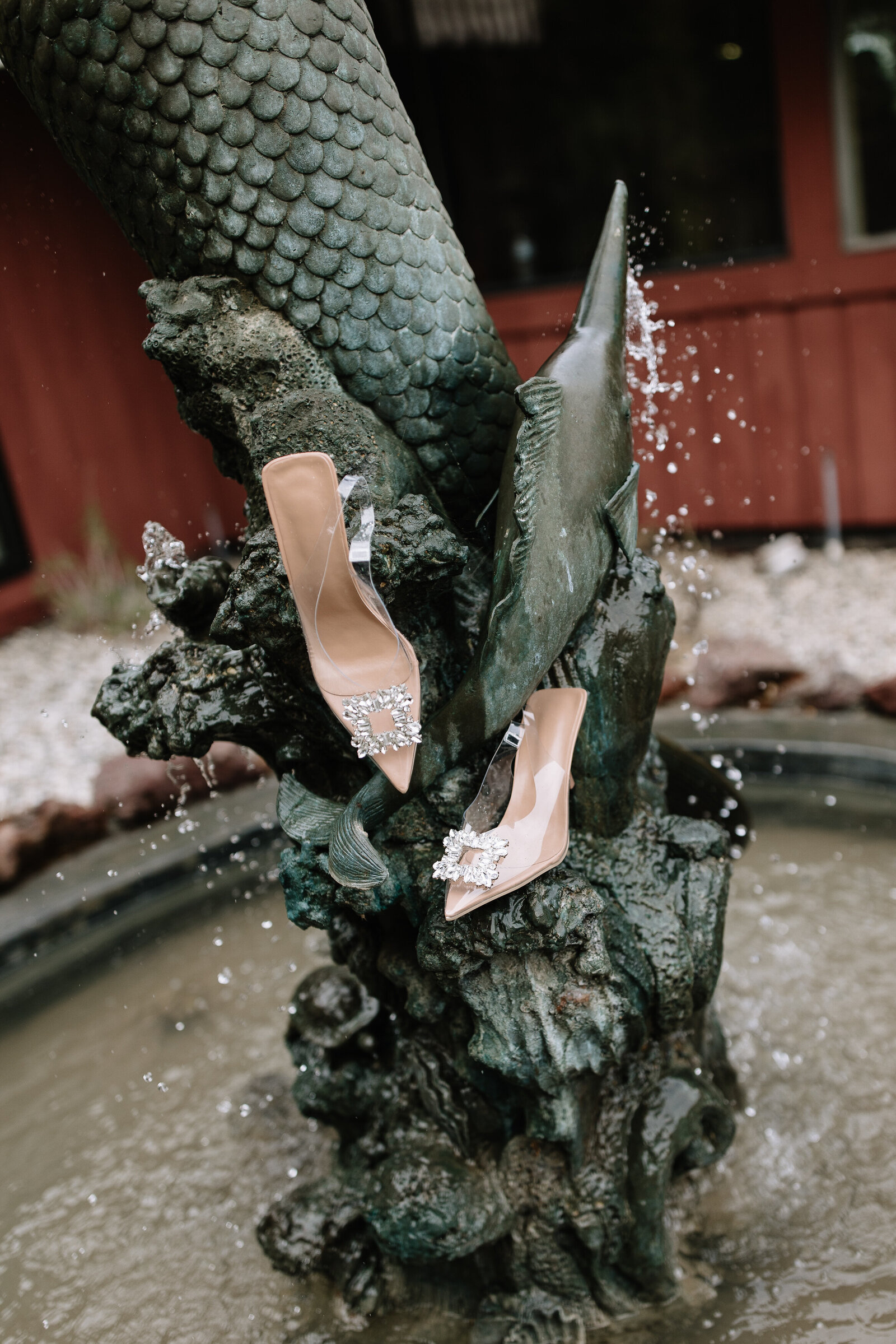 Bride heels placed in fountain during getting ready at Washington wedding venue, by Erica Rochelle Photography