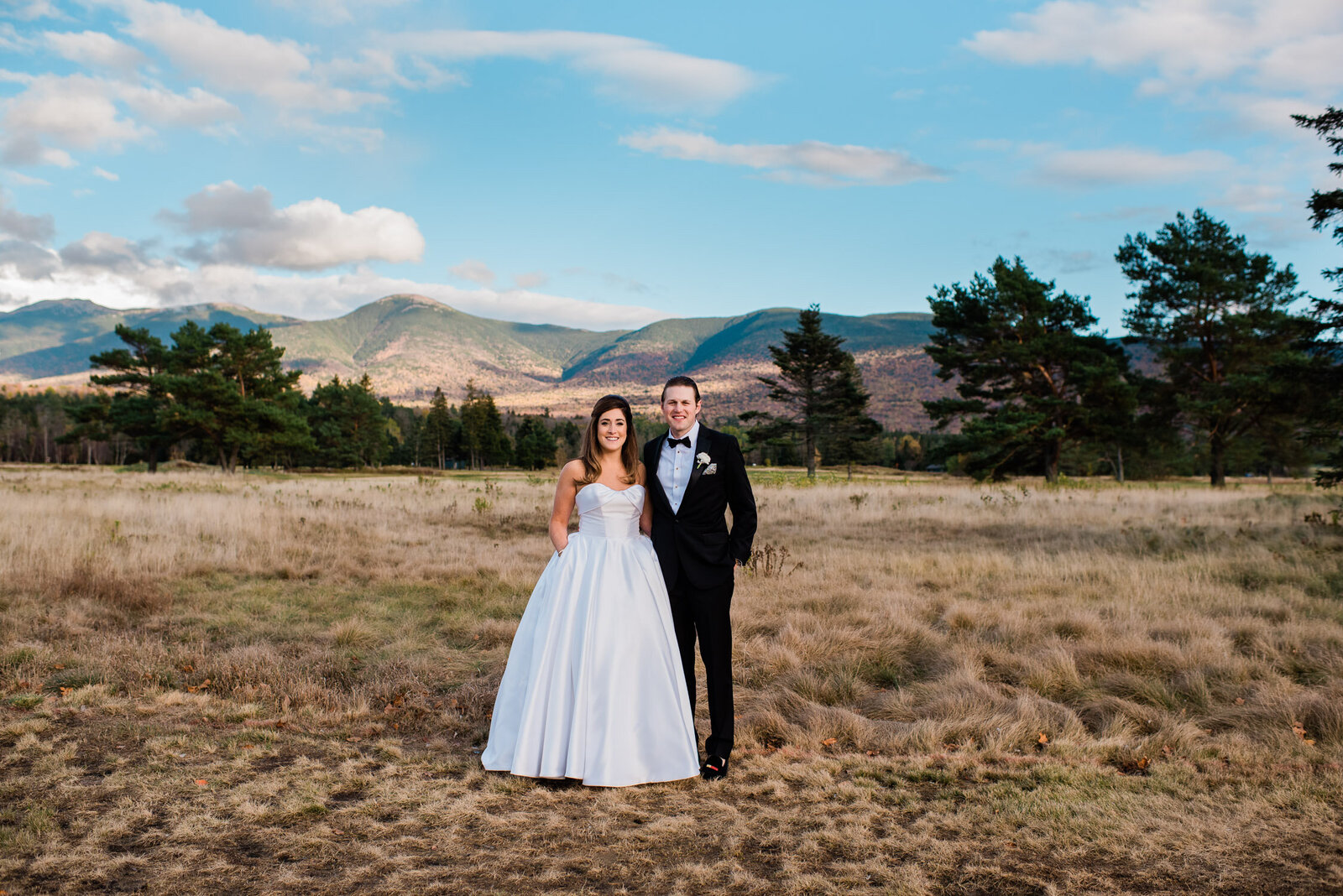 bride and groom portrait in front of mountains