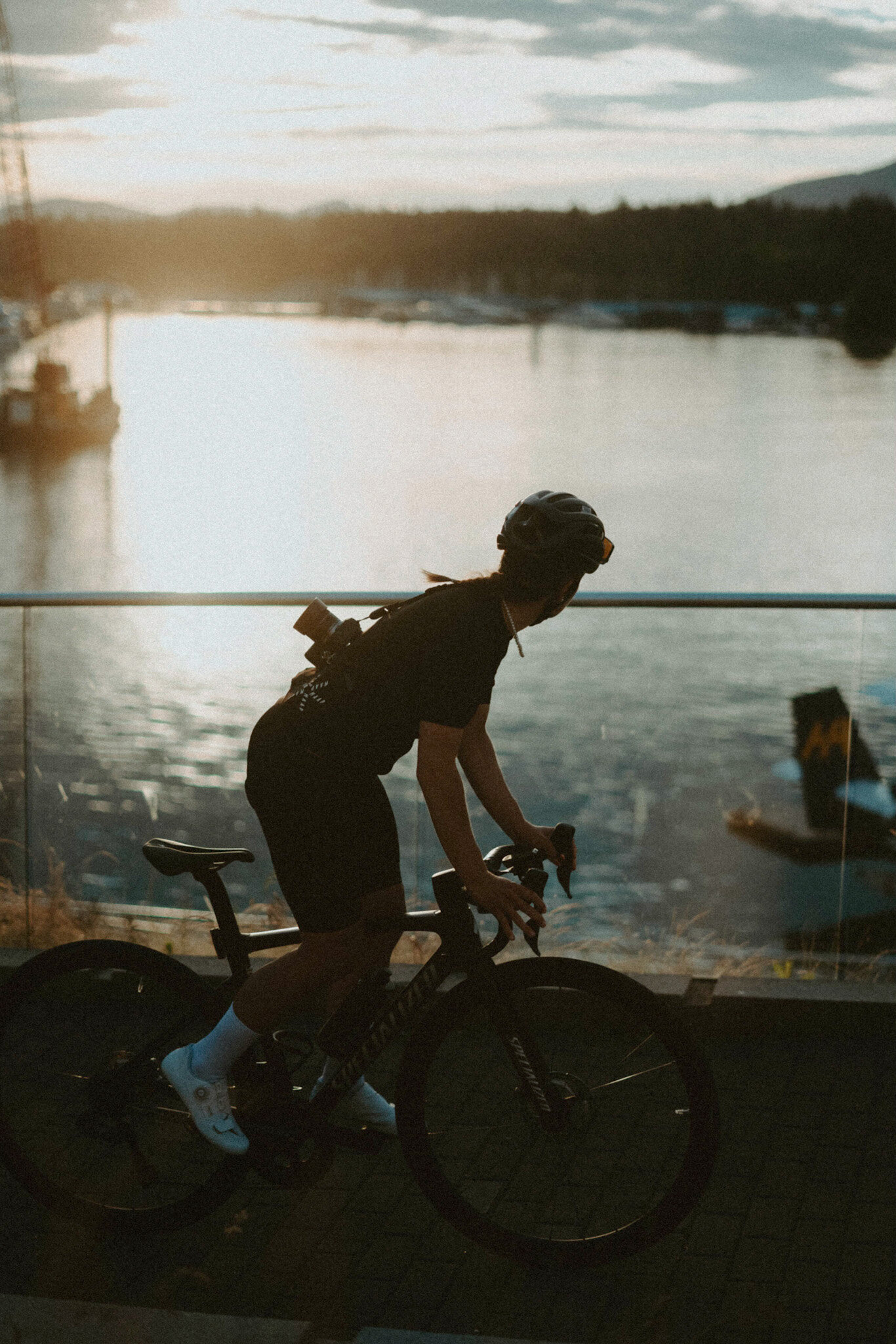 Cyclist on Coal Harbour Seawall At Golden Hour