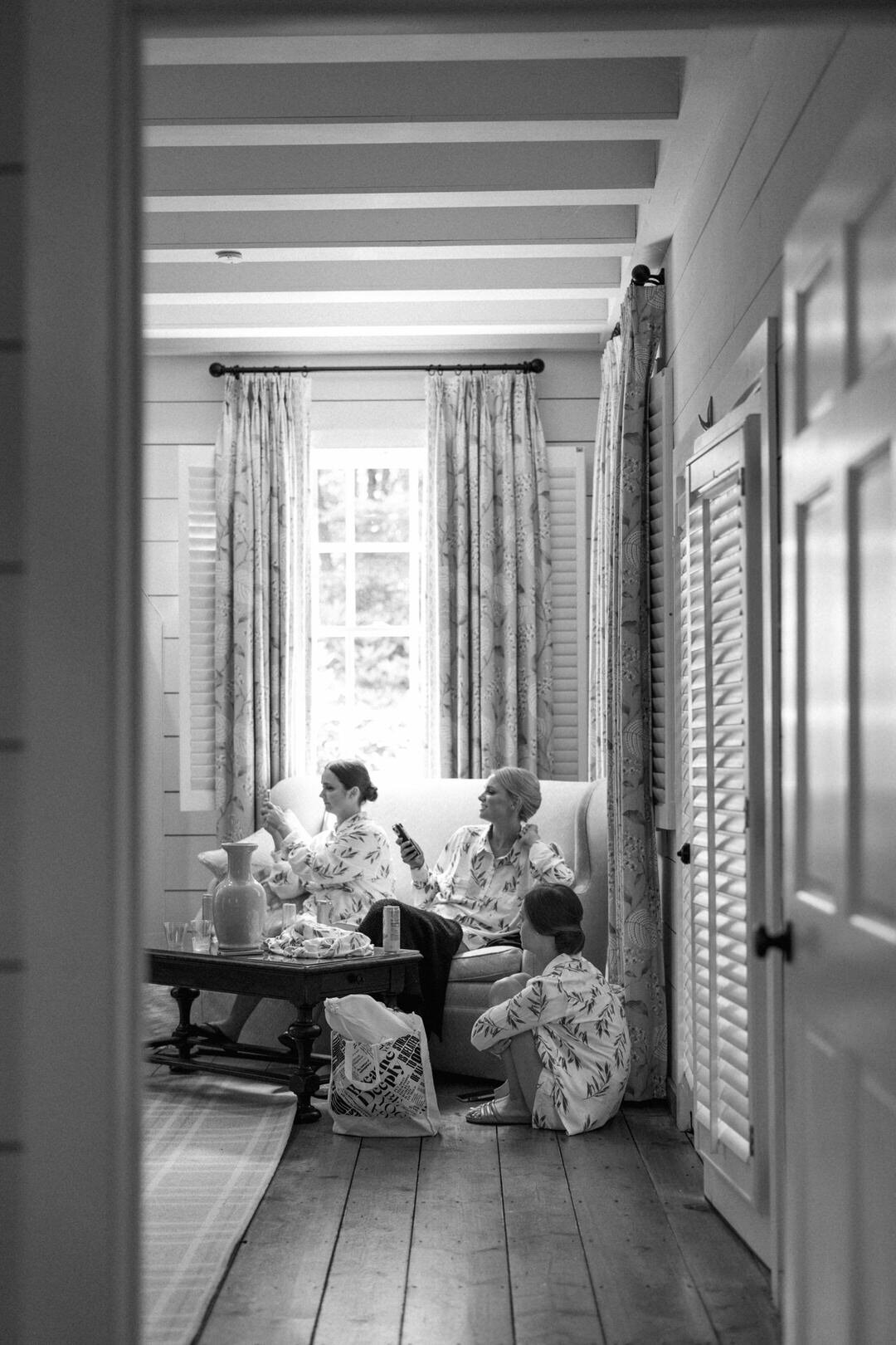 Black and White of Bridesmaids Laughing at Old Edwards Inn