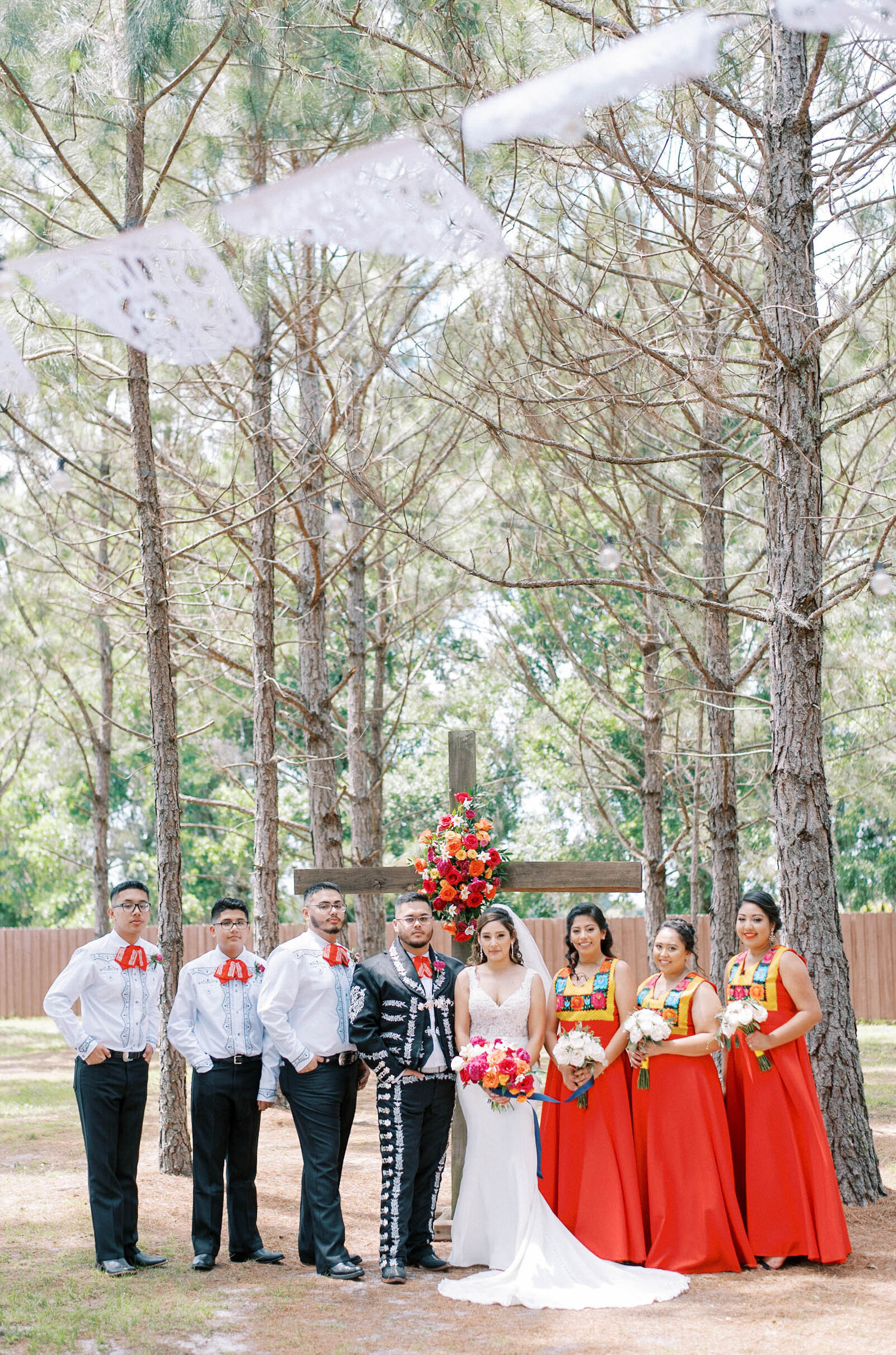 red bridesmaids dresses and groomsmen outdoor wedding in Florida