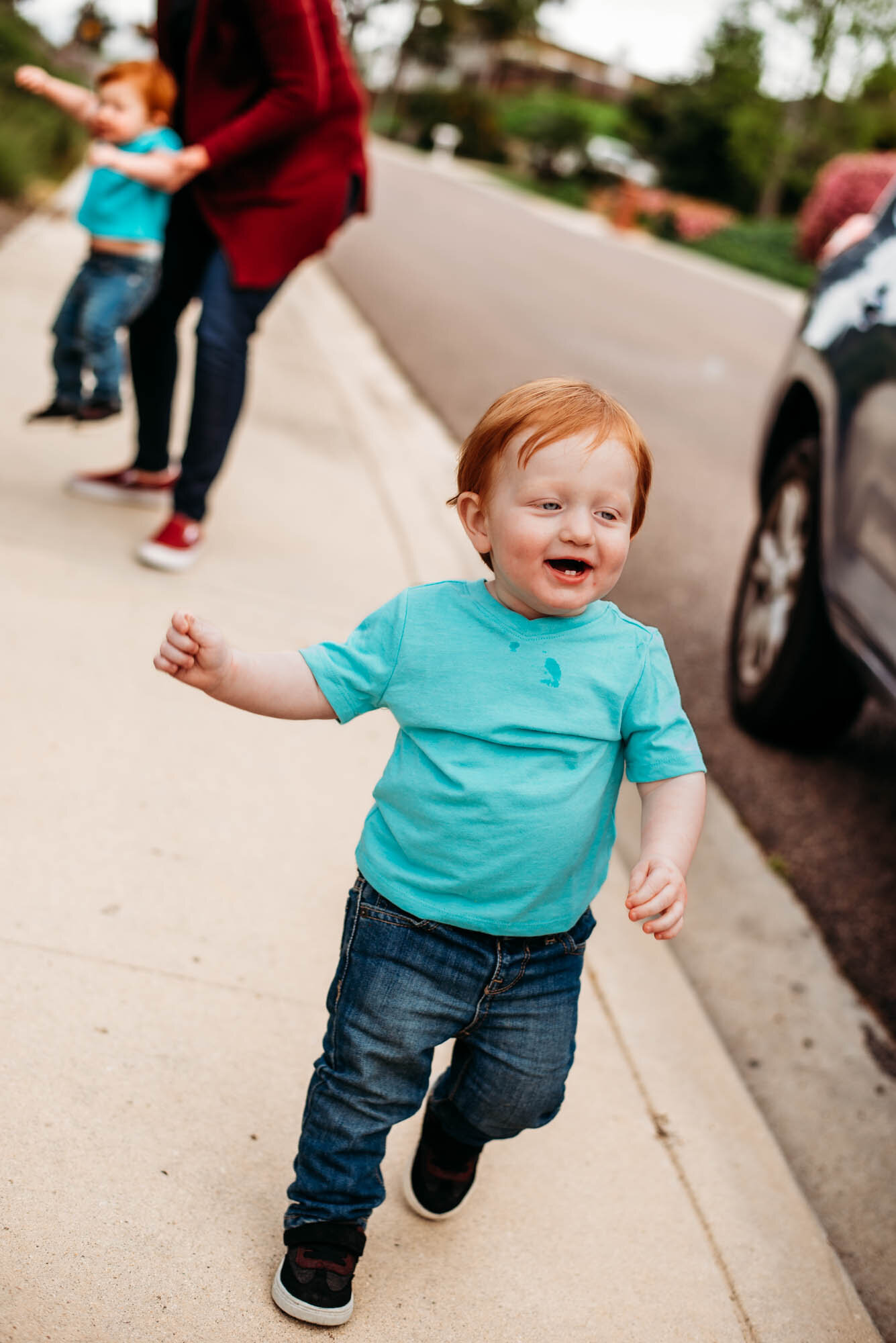 Toddler runs from grandmother during photos at Carlsbad area park