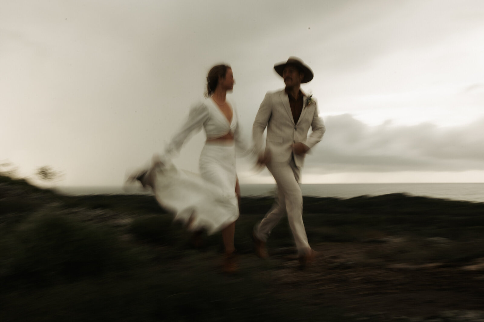 Couple eloping in a scenic mountain setting, with cinematic and storytelling photography style