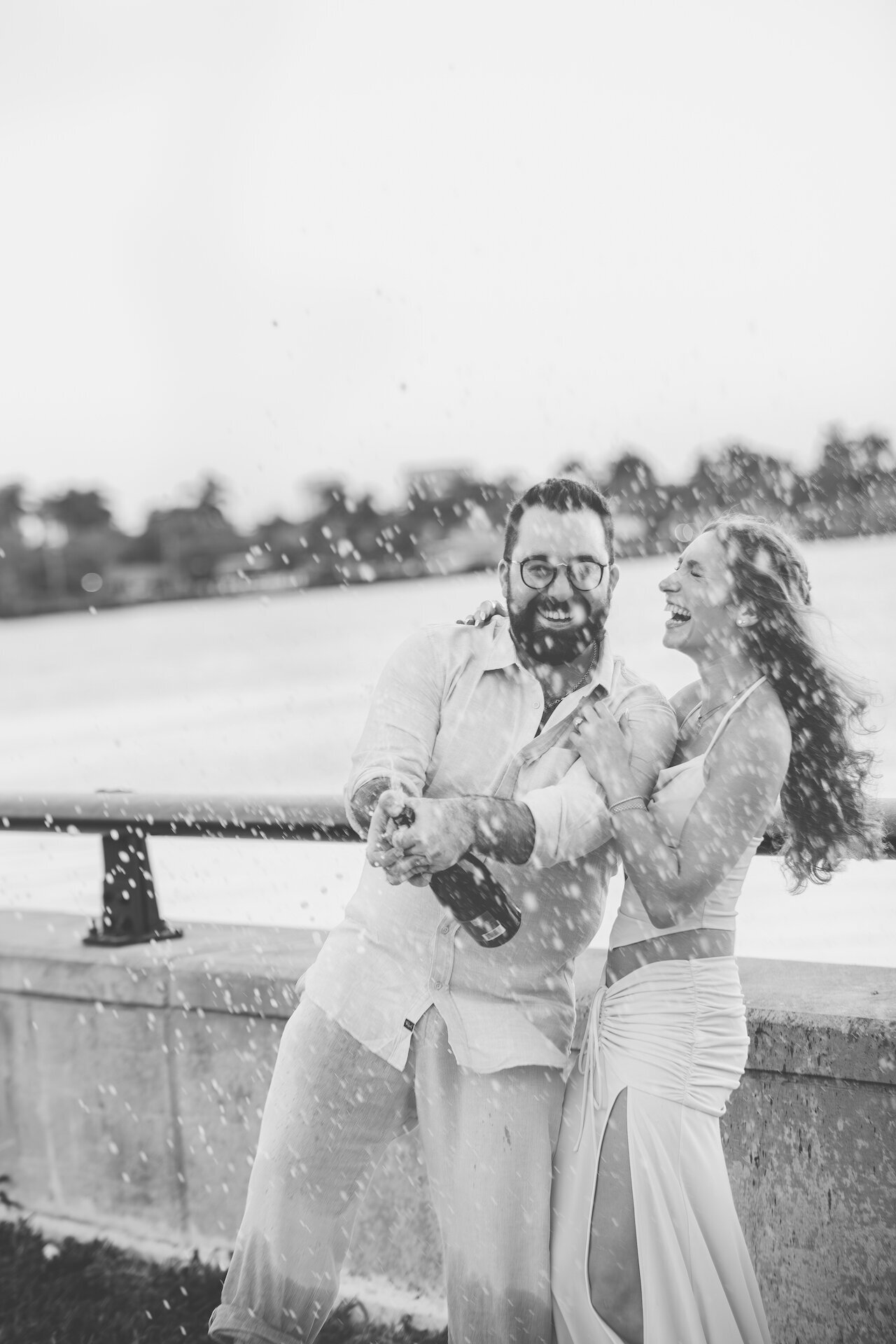 florida-engaged-couple-popping-champagne