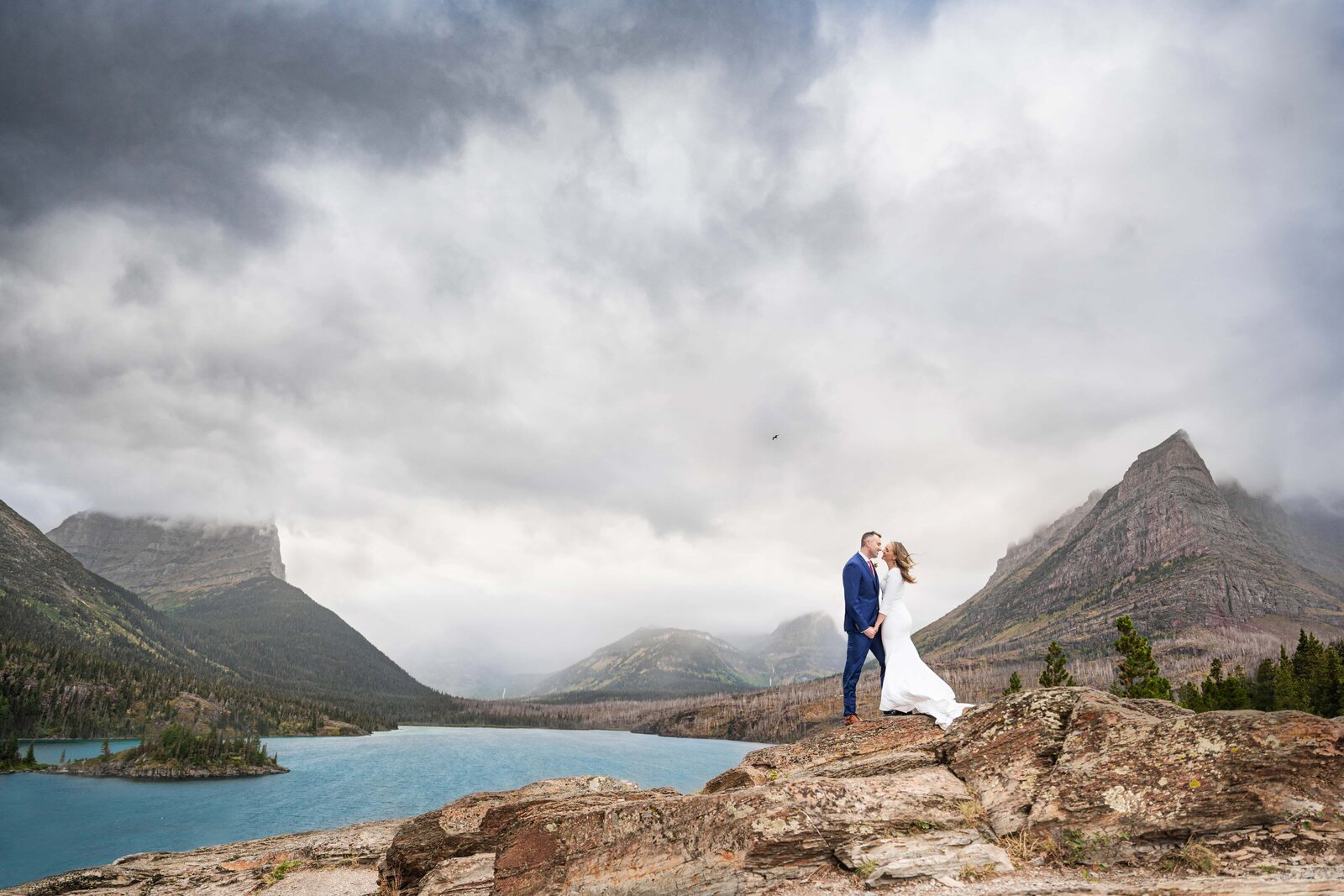 Bride and Groom during epic photo in Glacier National Park for their wedding session