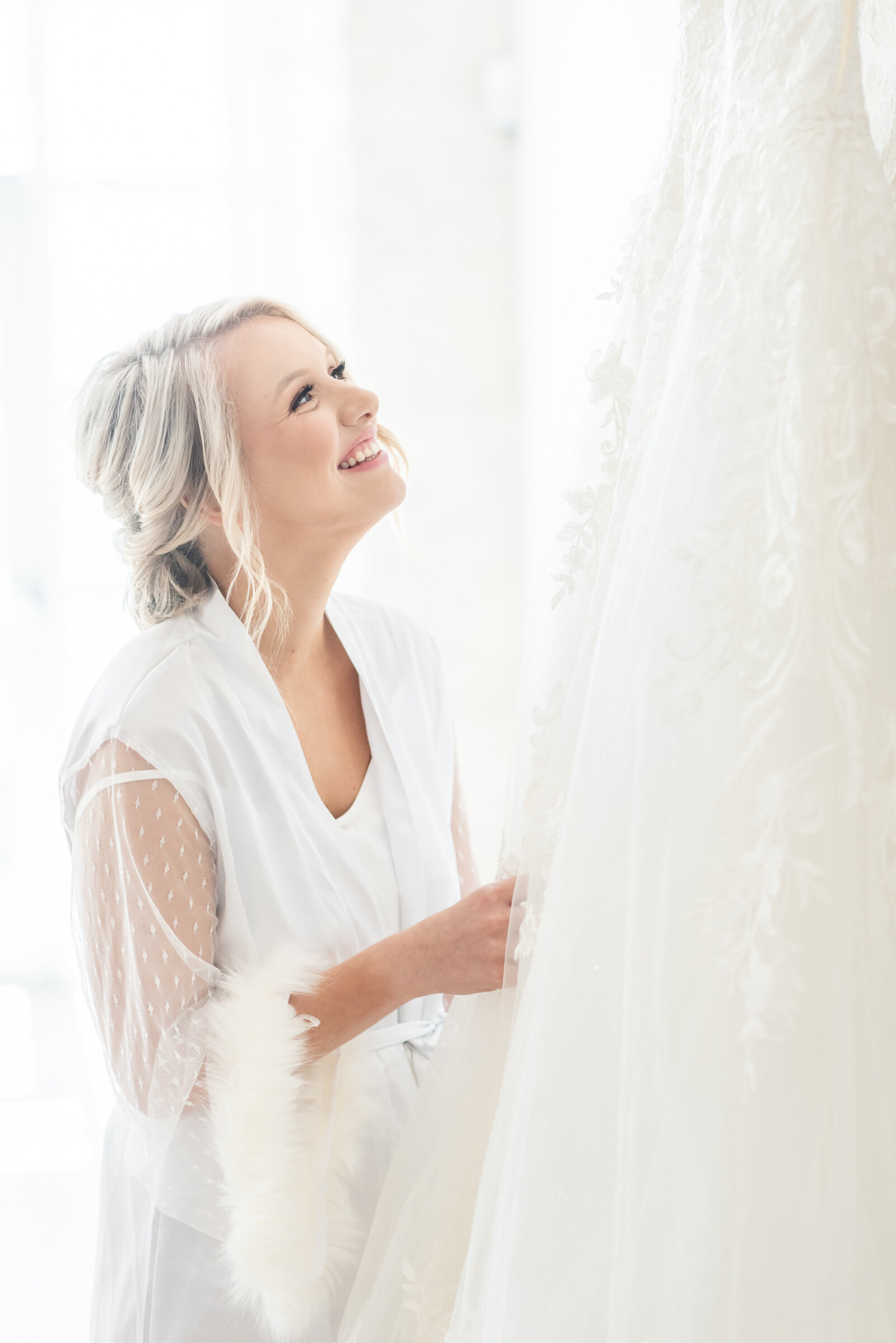 bride admiring her dress