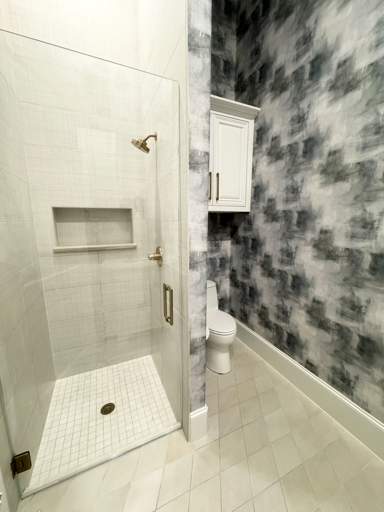 Designer home remodel for a bathroom featuring elegant decorations, including a luxurious bathtub and tasteful accents that enhance the space’s sophisticated style.