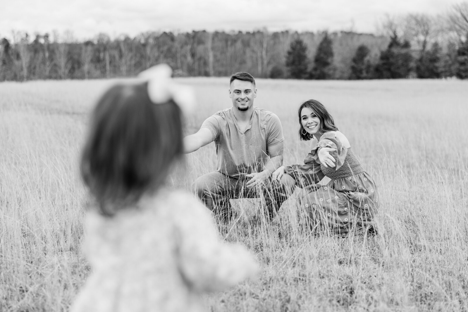 a toddler running to her parents