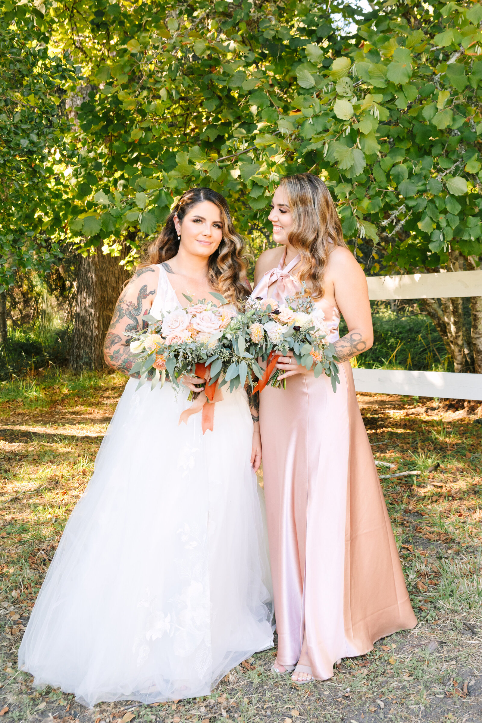 Tattoo bride and bridesmaid on her colorful wedding day in Santa Cruz, California.