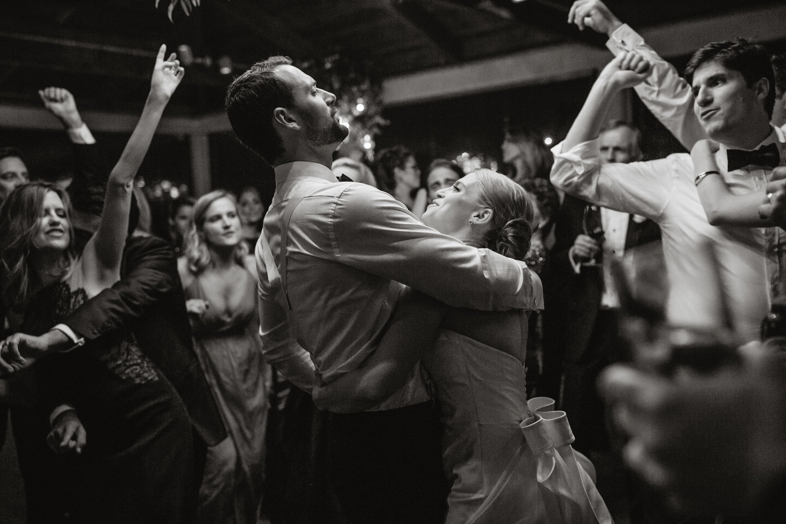 A memorable moment, captured by Sweetwater, of the bride and groom surrounded by their friends and family.