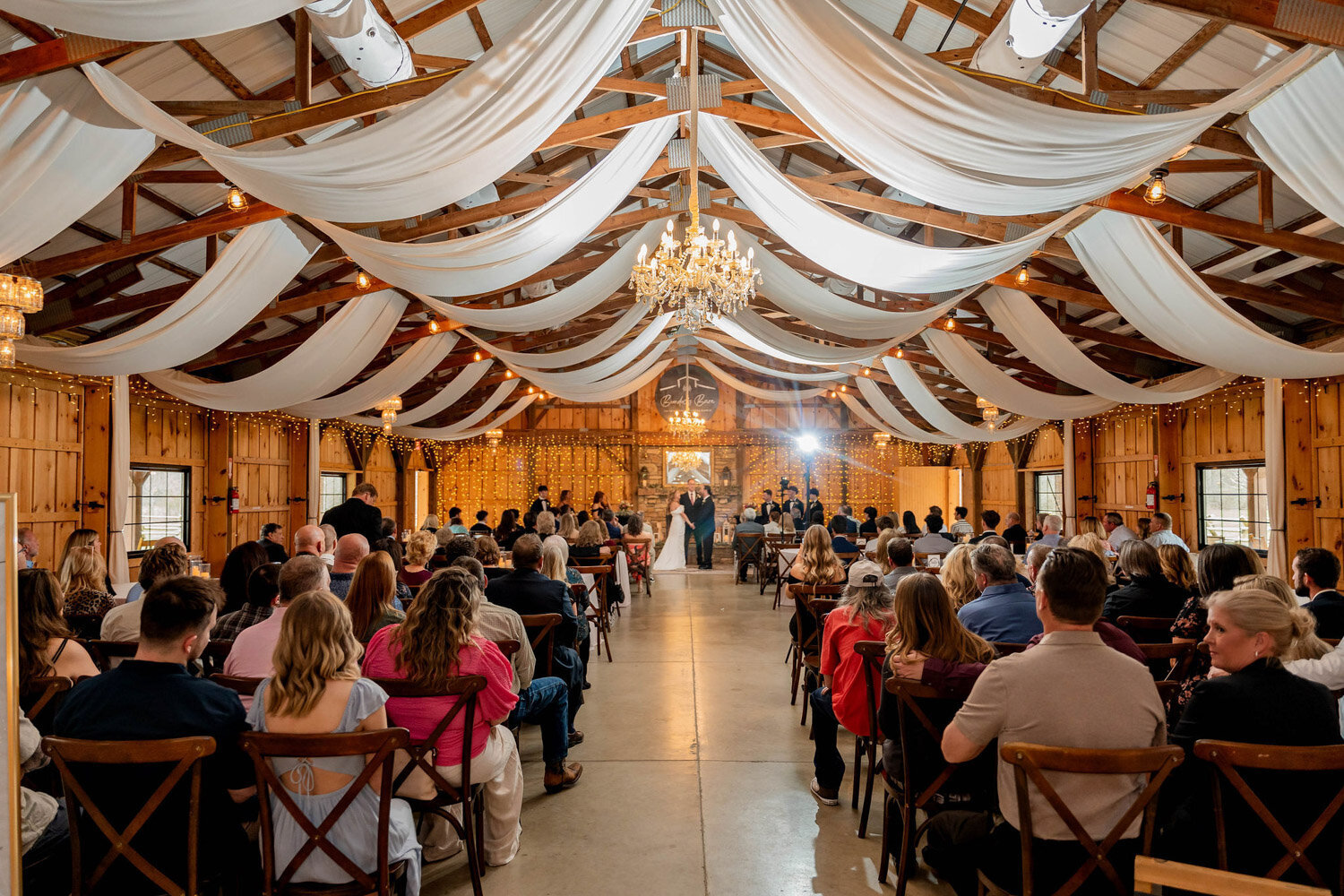 Indoor wedding ceremony designed with drapings