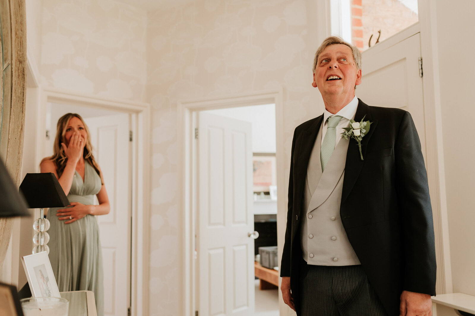 Surprise dad & sister seeing bride coming downstairs