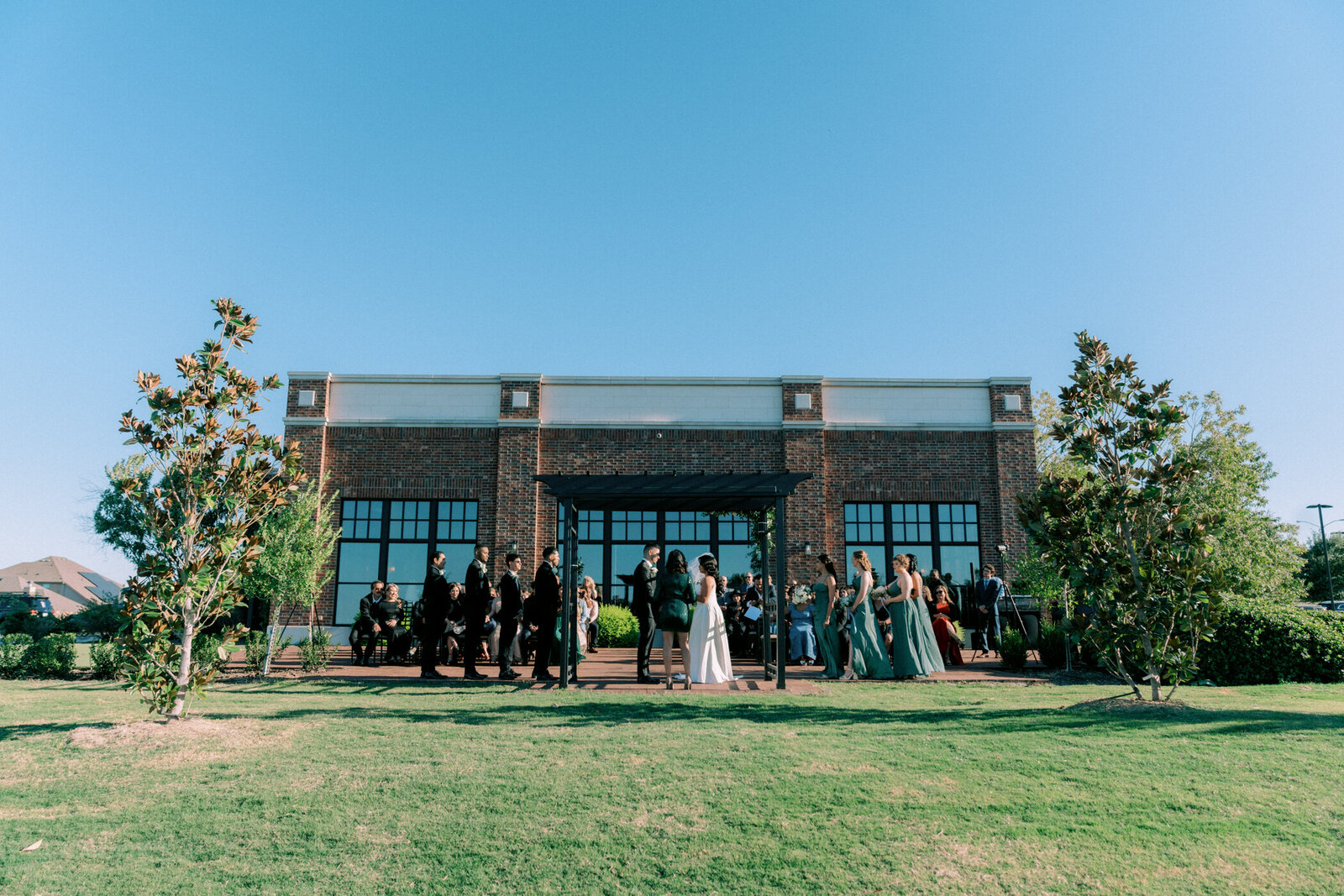 A sunset wedding takes place at The Dalmore Fossil Creek in Fort Worth Texas