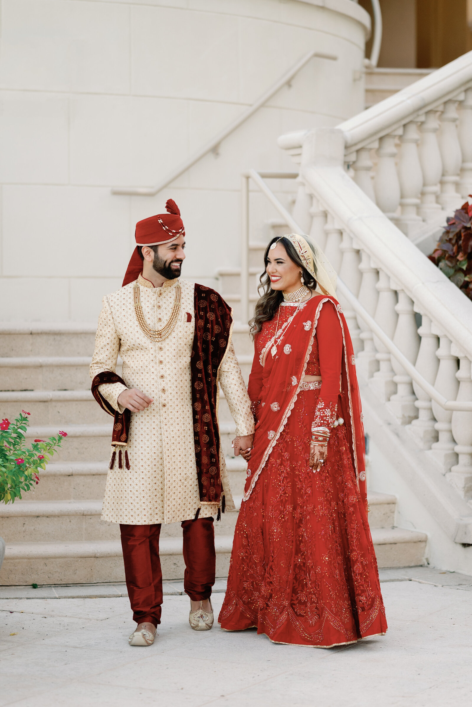 indian wedding couple walking and smiling together after their wedding day first look