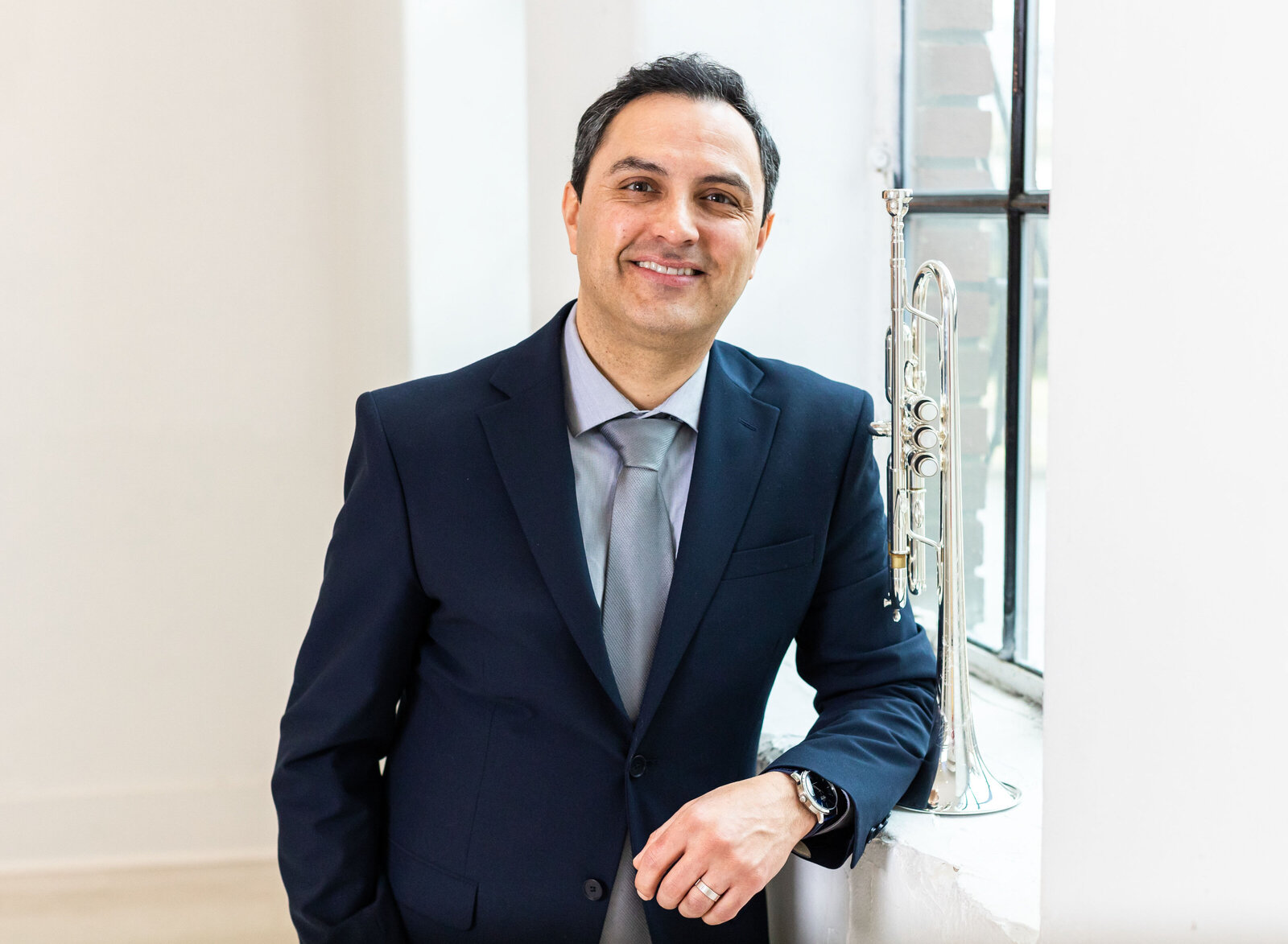 professional headshot guy with trumpet