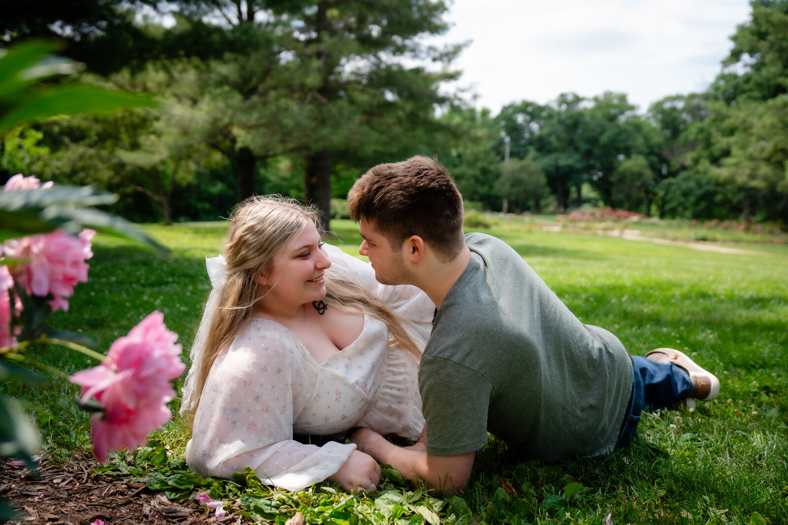 engagement photos at the rose garden in des moines iowa dreamy photos in the flowers