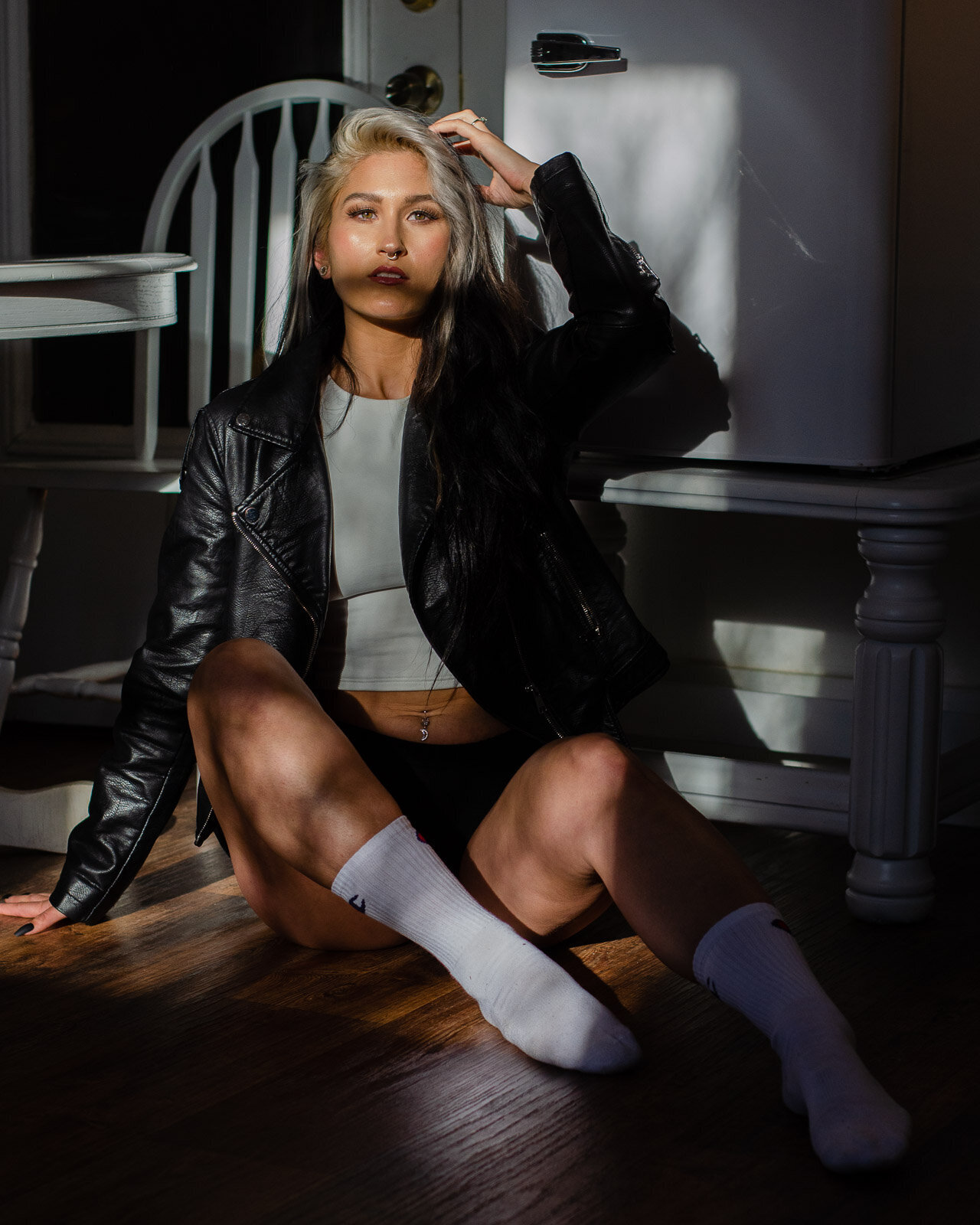woman in leather jacket and tube socks