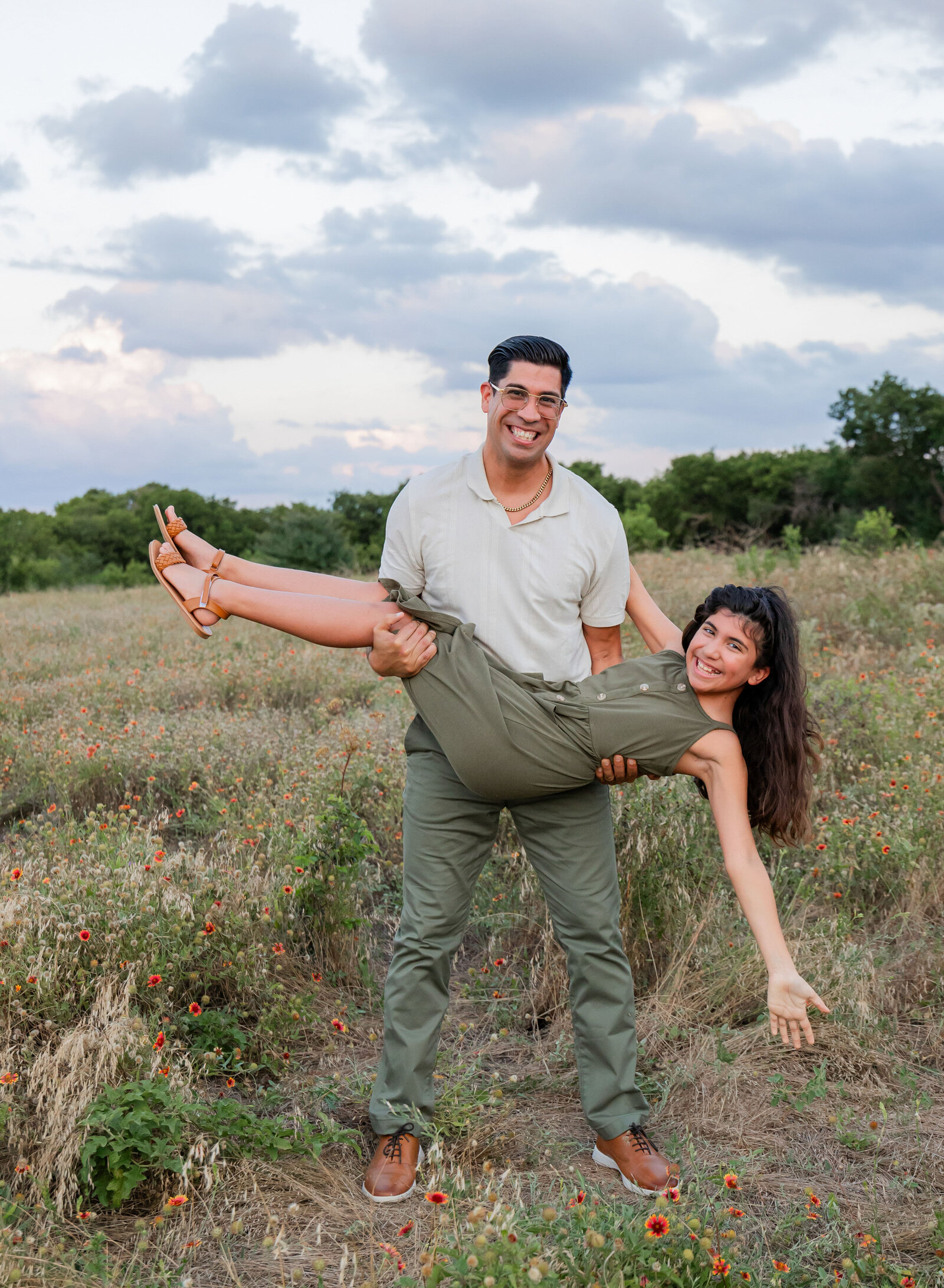 dad carrying daughter