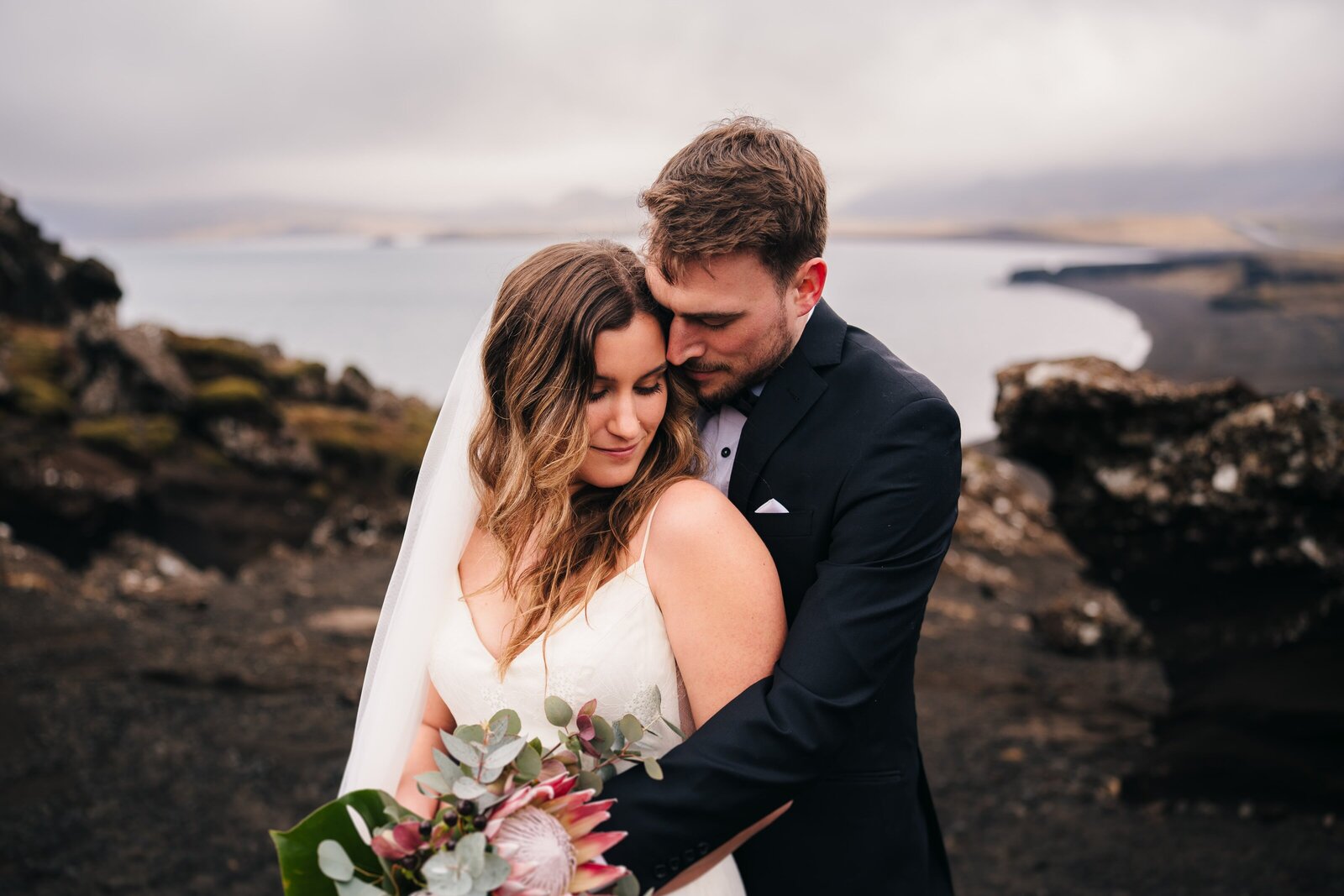 Couple sharing an embrace during their elopement in Iceland