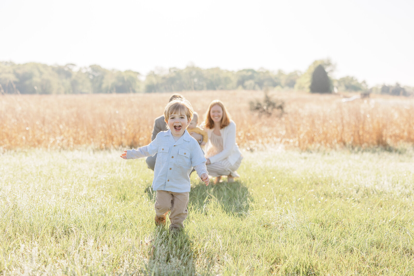 boy running with his tongue out during Fauquier County, VA family photography