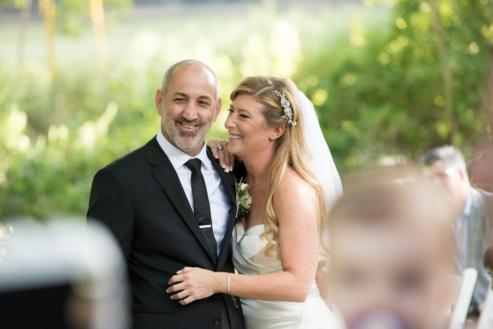 bride and groom looking happy at George Weir Barn