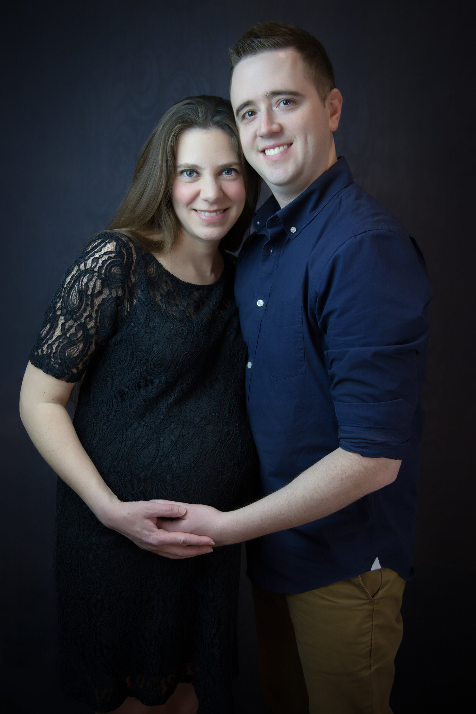 Pregnant couple in photography studio in Kennebunk Maine