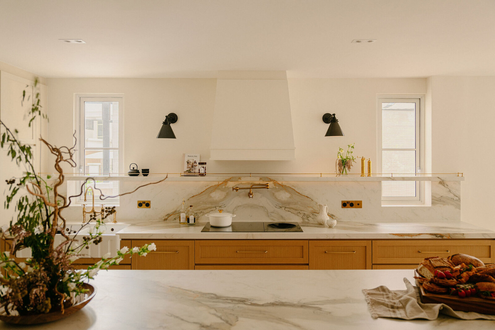 Marbled kitchen countertop, rustic, farmhouse inspired interior design within a house in Singapore by Haus Atelier